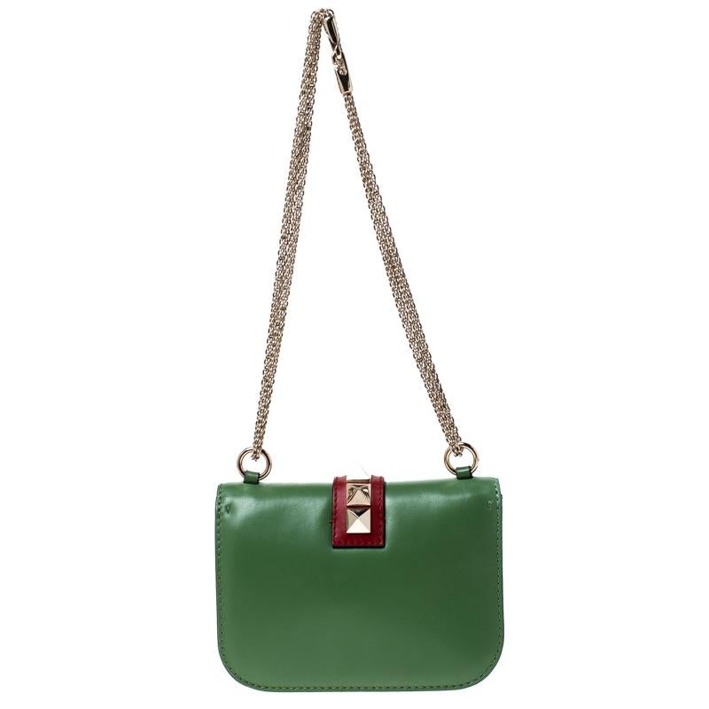 If you are looking for a bag with a blend of modern style and class, this Valentino creation is the answer. Crafted from leather, this multicolor piece comes with a gold-tone chain and a flap with a push-lock to secure the well-sized interior. The