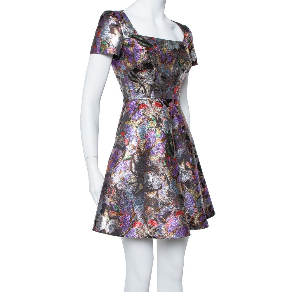 This stunning dress comes from the house of Valentino. It has been crafted from a quality fabric blend and flaunts pretty hues all over. This A-line dress has been styled elegantly with a flared skirt, a butterfly pattern, and short sleeves. Pair