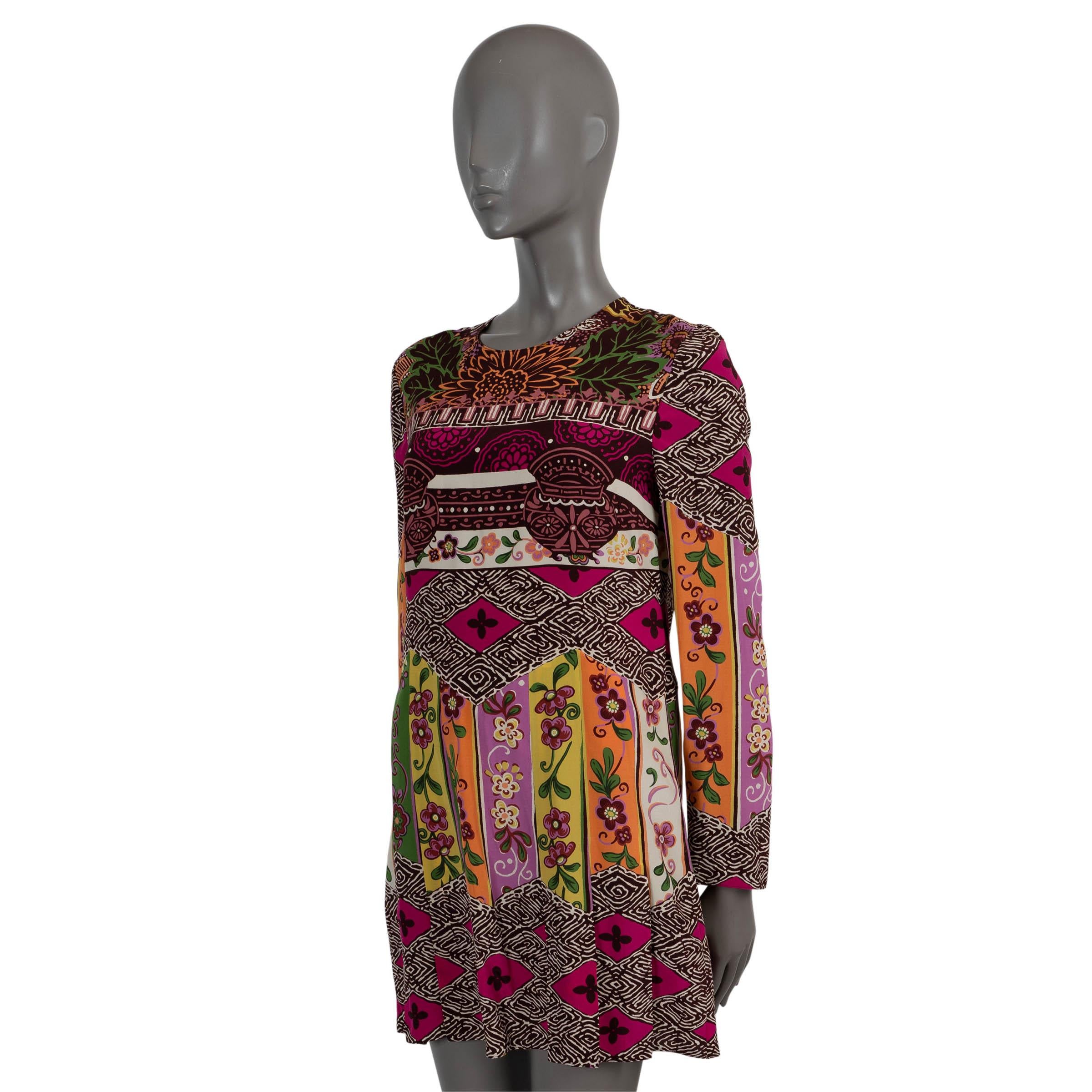 100% authentic Valentino long sleeve mini sheath dress in multicolor floral-print silk (100%). Features a round neck and pleated skirt. Closes with a concealed zipper in the back. Has been worn and is in excellent condition.

Complete the look with