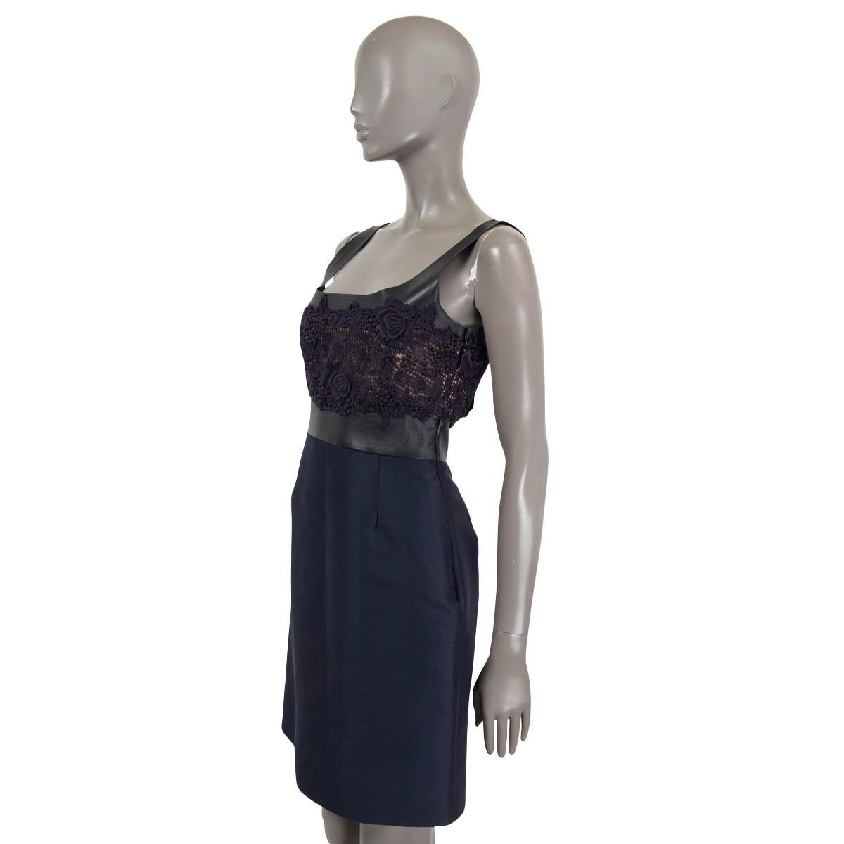 100% authentic Valentino knee-length fit and flare dress in midnight blue silk (100%). Features a lace top with nude lining and leather waistband. Closes with a concealed zipper on the side. Has been worn and is in excellent