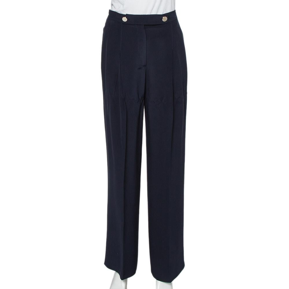 Valentino's palazzo pants represent the brand's love for lighthearted designs. Cut to a flattering silhouette, they feature a lovely navy blue hue all over. These silk pants come with pockets, a zip closure and flaunt a pleated design.

