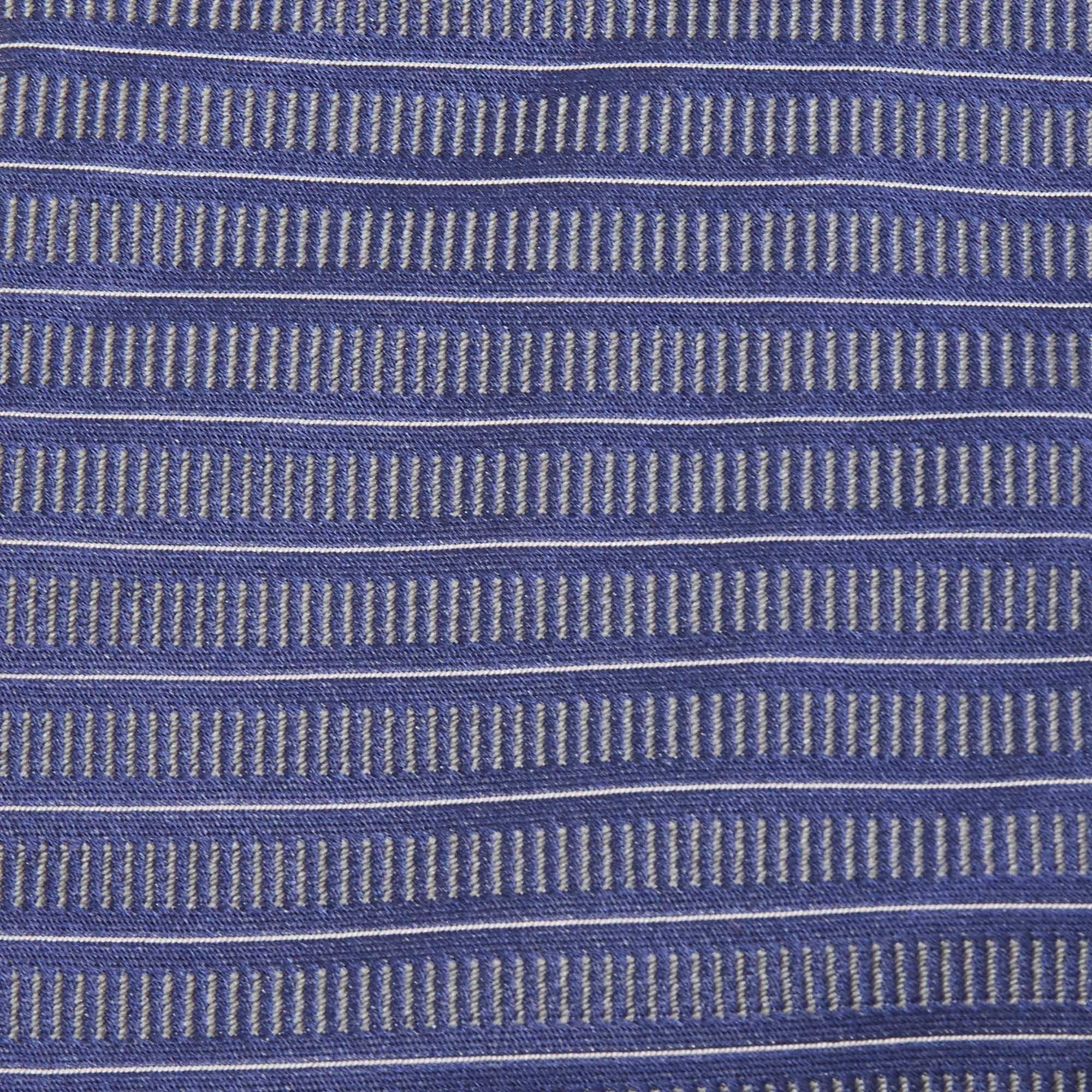 Pick this Valentino tie to give your formal look a touch of luxury. It is cut from silk and detailed with patterns all over. It is finished with the brand label on the back.