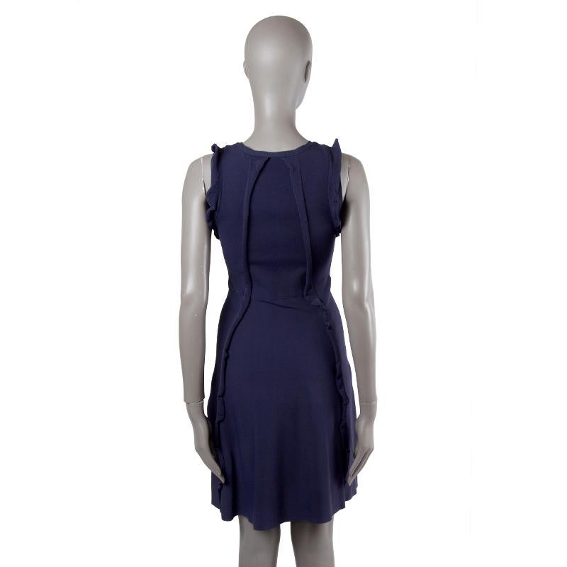 Valentino dress in navy blue viscose (with 17% polyester) with ruffled details. Unlined. Has been worn and is excellent condition.

Tag Size S
Size S
Bust 76cm (29.6in) to 84cm (32.8in)
Waist 64cm (25in) to 72cm (28.1in)
Hips 88cm (34.3in) to 96cm