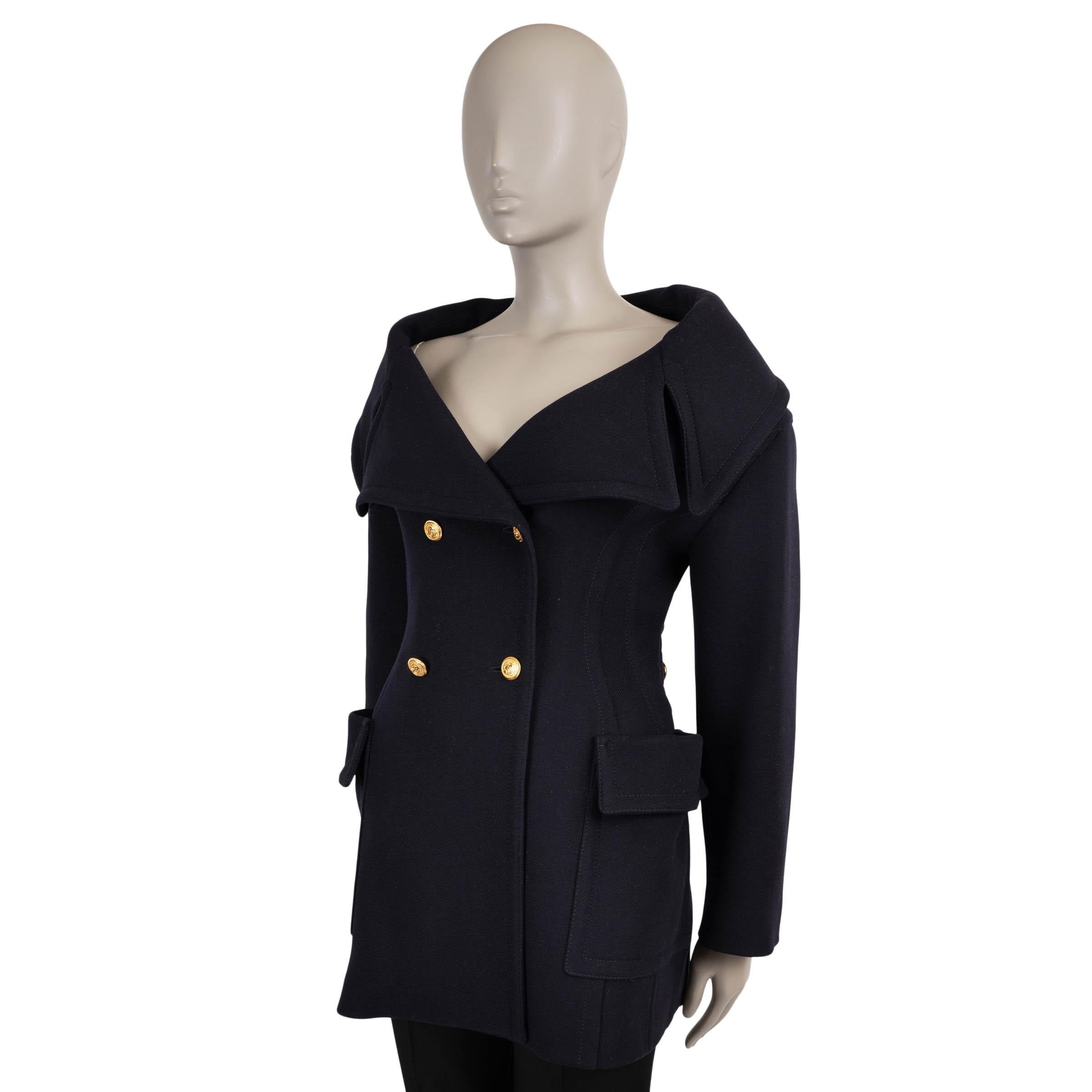 This 100% authentic Valentino peacoat is crafted in navy blue twill wool (100%), offering a refined take on classic outerwear. The design showcases a feminine, fitted silhouette with an off-shoulder, oversized portrait collar, adding dramatic