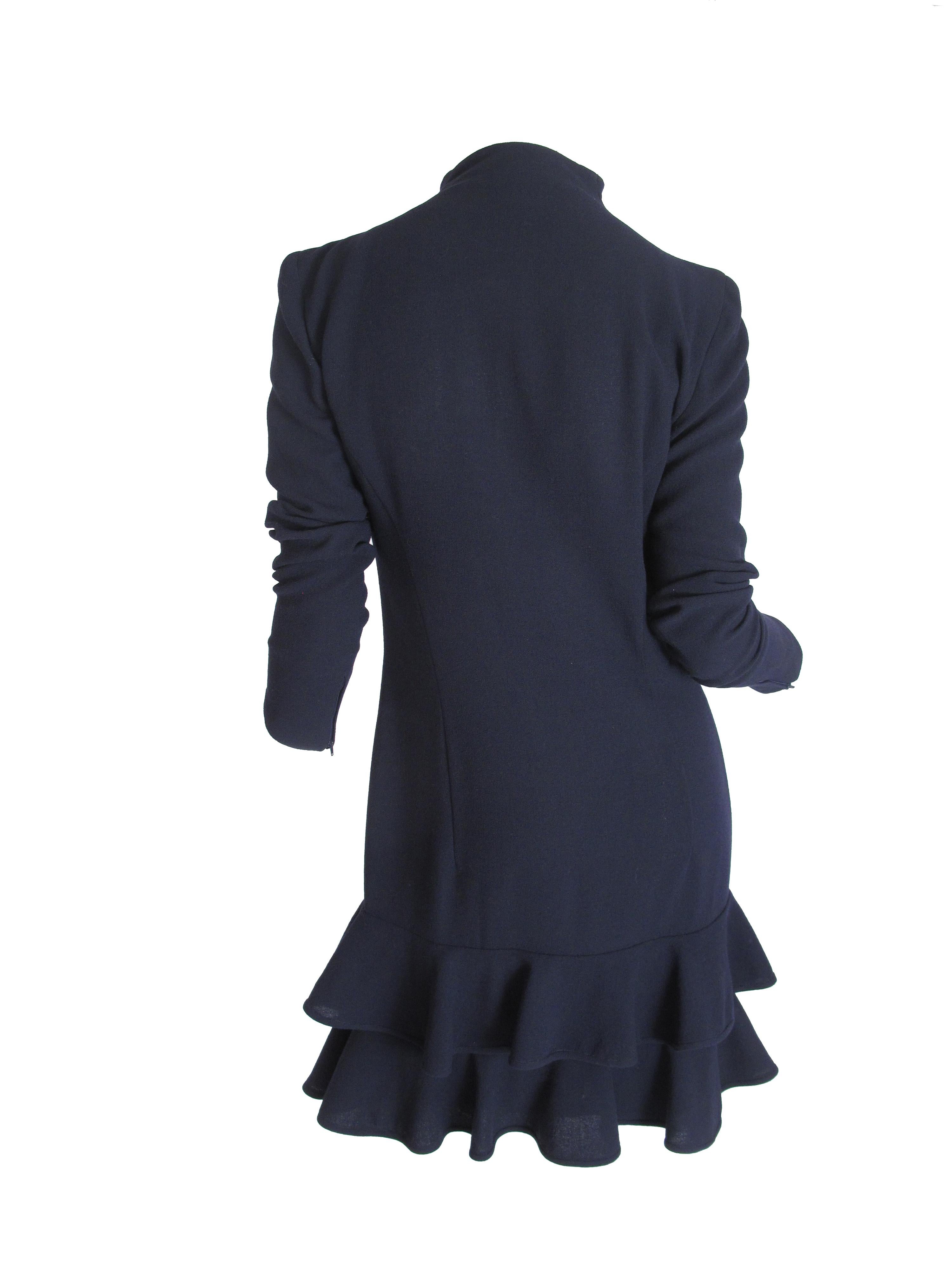 Valentino navy wool dress with zipper front and ruffles at hem. Condition: Very good. Size 8
