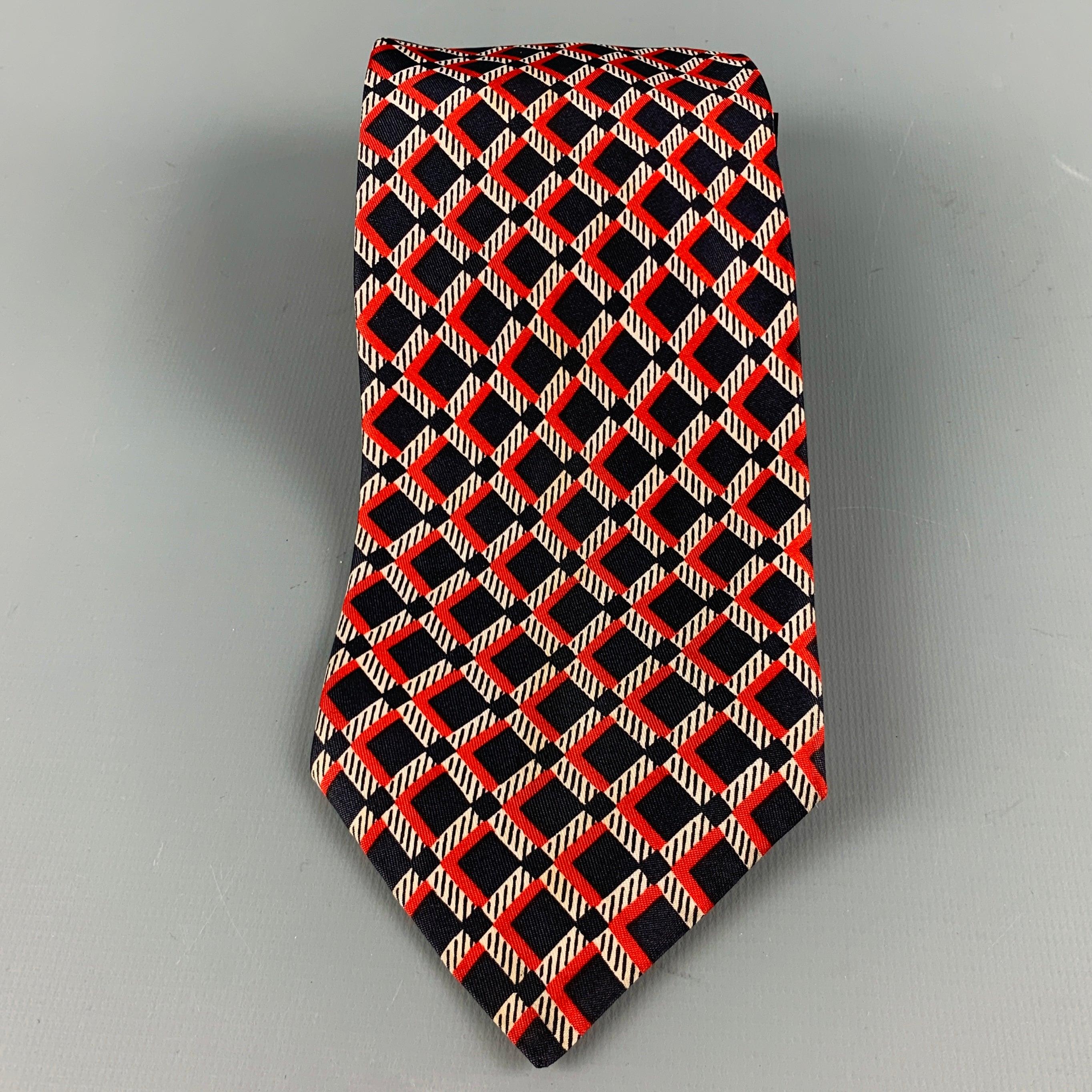 VALENTINO
necktie in a navy and red silk fabric featuring checkered pattern. Made in Italy.Excellent Pre-Owned Condition. 

Measurements: 
  Width: 3.5 inches Length: 54 inches 
  
  
 
Reference No.: 128756
Category: Tie
More Details
    
Brand: 