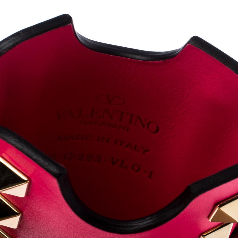 For people with an eye for fashion, this Valentino iPhone case will hold it in style. Crafted in neon pink leather, it is accented with gold-tone metal Rockstuds on the exterior and is lined with leather.

Includes: Original Box

