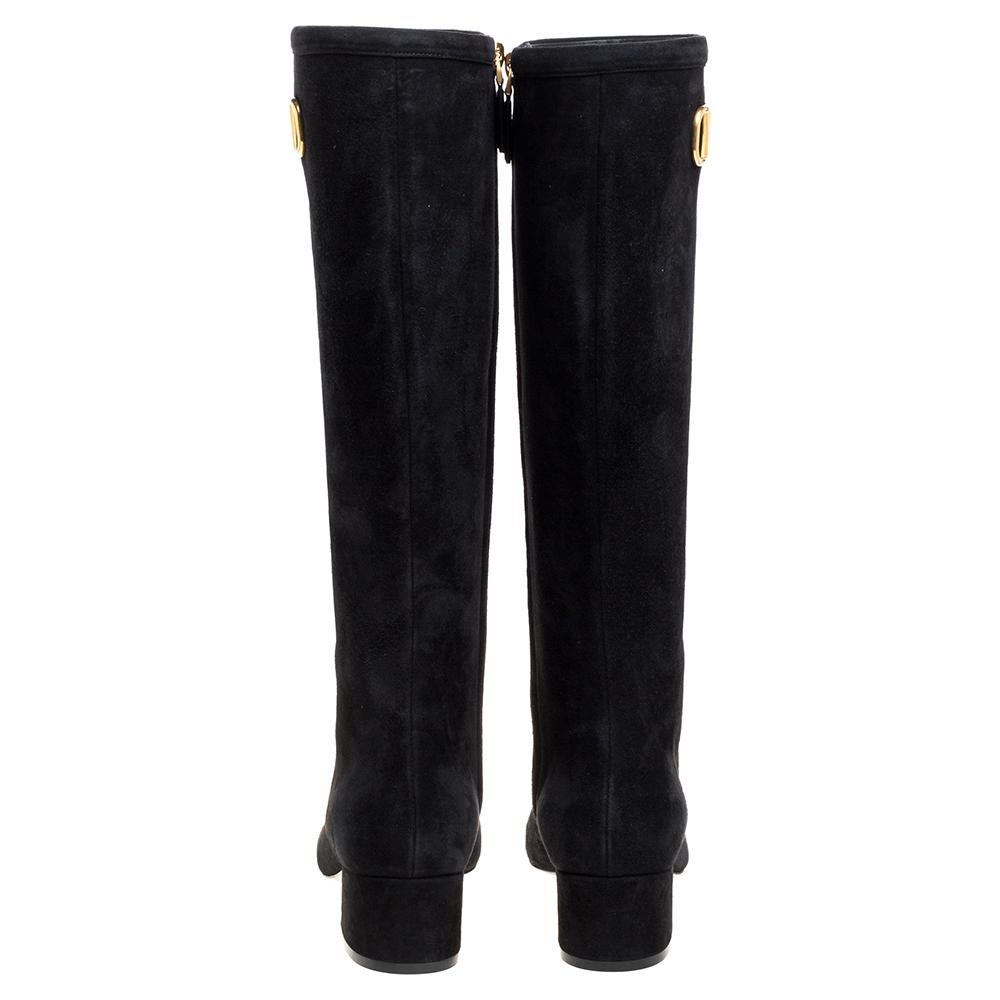 Classy and sophisticated are the words that perfectly define these boots by Valentino. Crafted from quality suede in a classic black shade, these knee-length boots feature the VLOGO detailing and short block heels for a comfortable fit.

Includes: