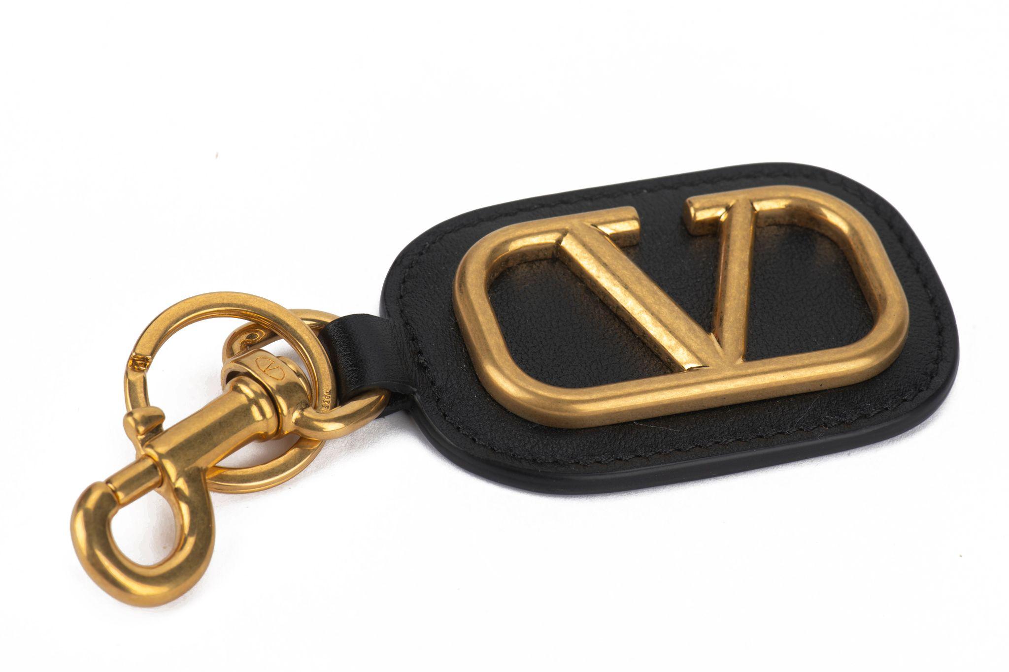 Valentino brand new logo keychain with hook. Black leather and antique gold tone hardware. 
Comes with booklets, tag, original dustcover and original box.