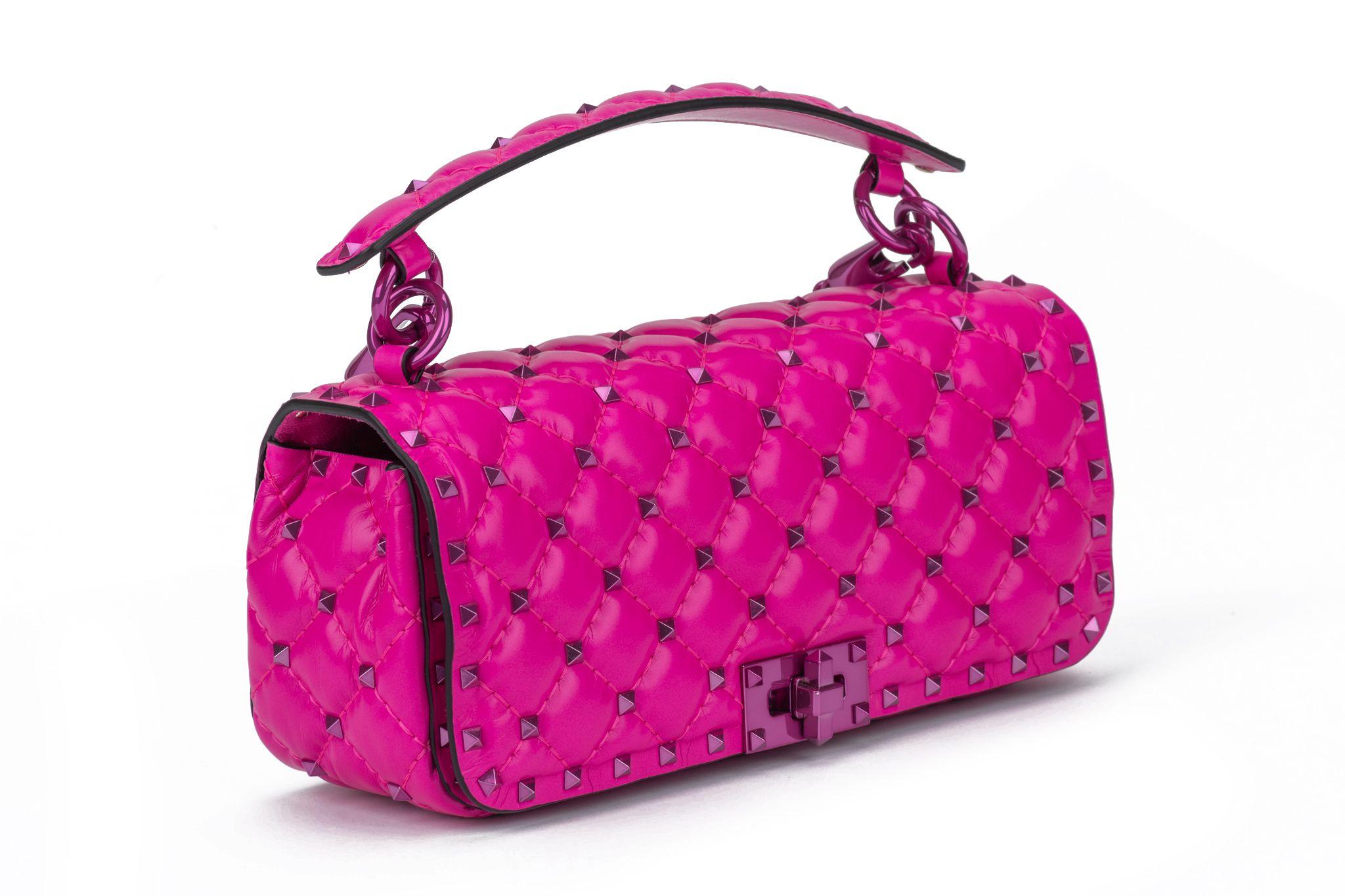 Valentino Garavani Rockstud Quilted Calfskin Convertible  hot Pink Shoulder Bag with pink studs and hardware.  Handle drop 3”, chain drop 11”, shoulder drop 21.5. The bag is new and comes with the original booklet and dustcover.
