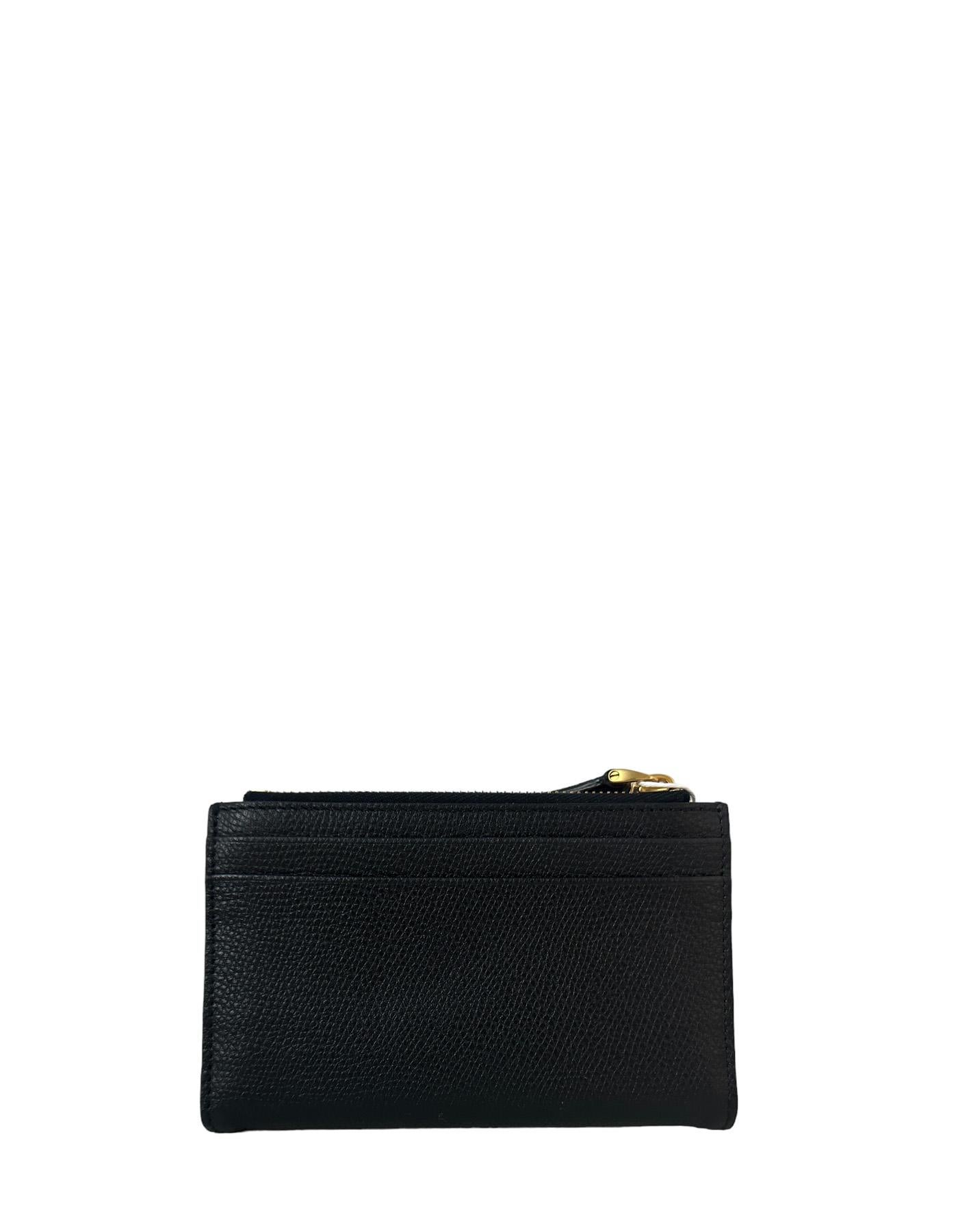 Valentino Vlogo Black Signature Grainy Calfskin Cardholder Wallet 

Made In: Italy
Color: Black
Hardware: Goldtone
Materials: Grainy calfskin leather
Lining: Leather
Closure/Opening: Snap button 
Exterior Pockets: Eight credit card slots, two back