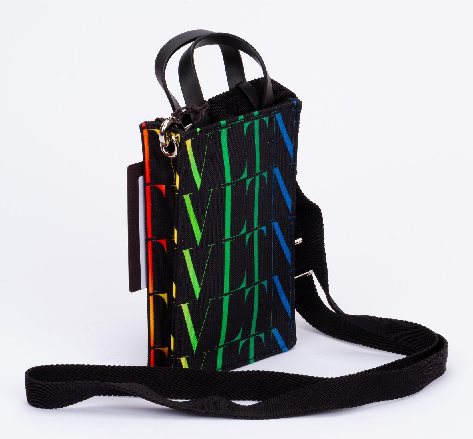 Valentino bag made out of leather with the logo printed on it which fades from green to blue. The bag comes with a adjustable and detachable shoulder strap (drop up to 26