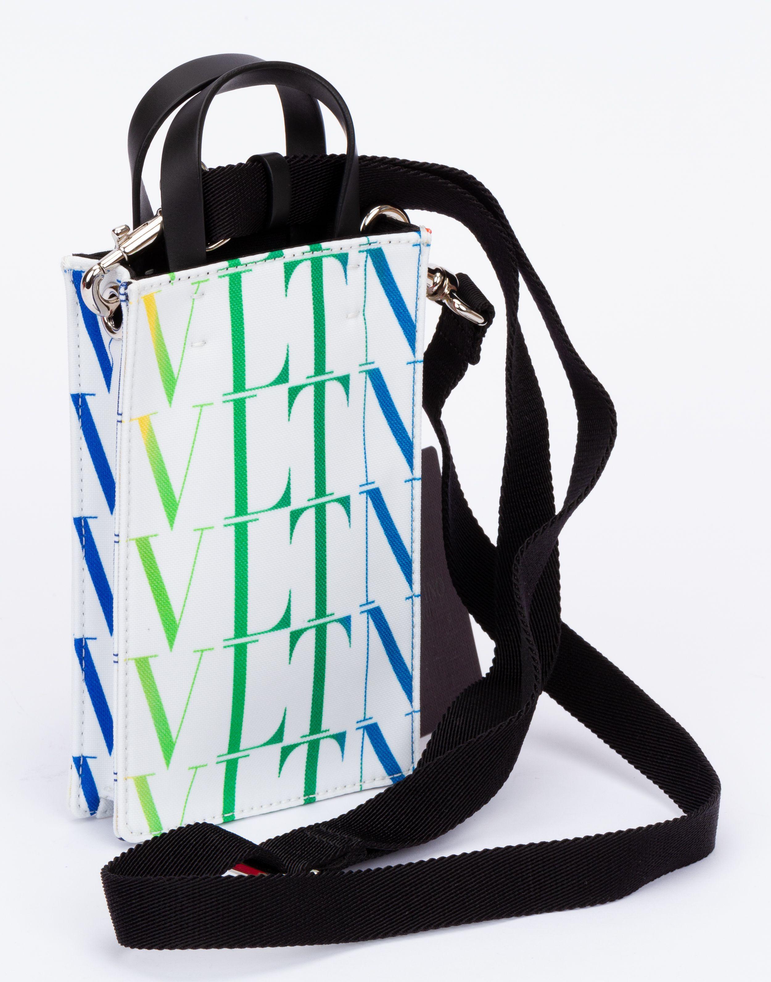 Valentino bag made out of leather with the logo printed on it which fades from green to blue. The bag comes with a adjustable and detachable shoulder strap (drop up to 26