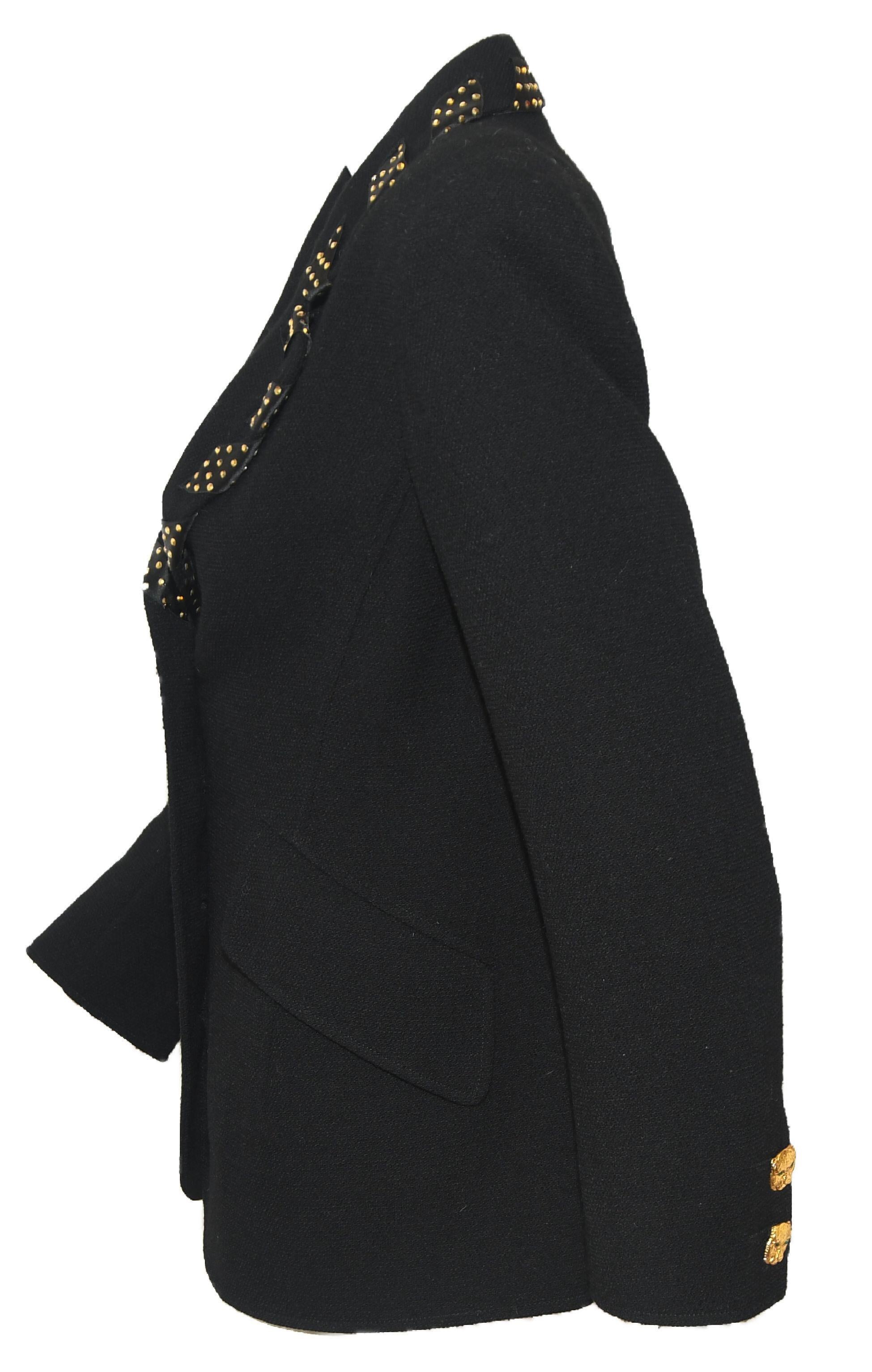 Valentino Night black jacket is decorated with black satin ribbon with gold tone crystals allover wrap around the collar and the lapels.  This jacket,also, includes two faux flap pockets at front.  The jacket is protected by 4 gold tone leopard