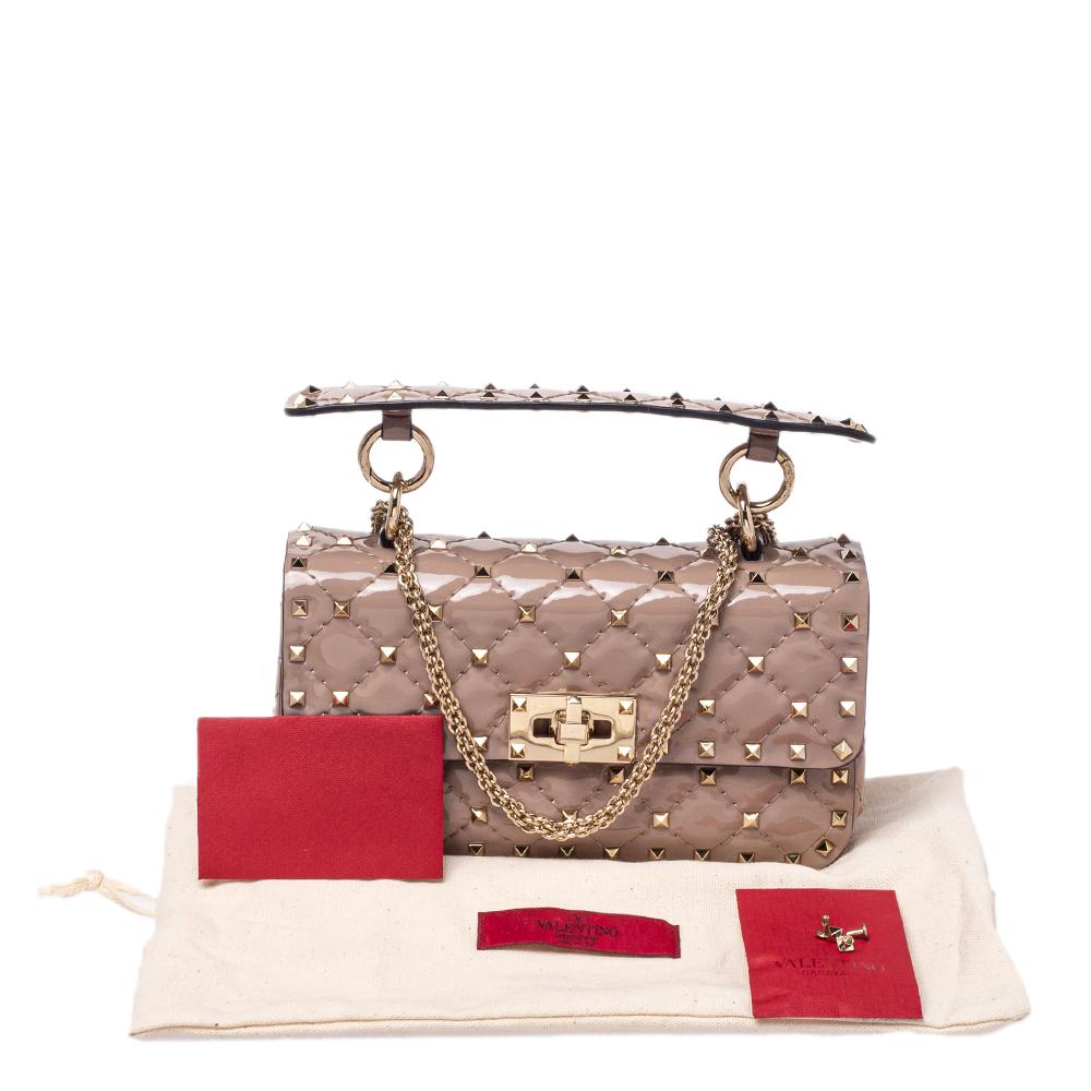 The Valentino Rockstud Spike bag is loved by celebrities and will help you create a statement-making look. It is secured by a twist lock on the flap and punctuated with the label’s signature Rockstuds, each artfully placed on the quilted patent