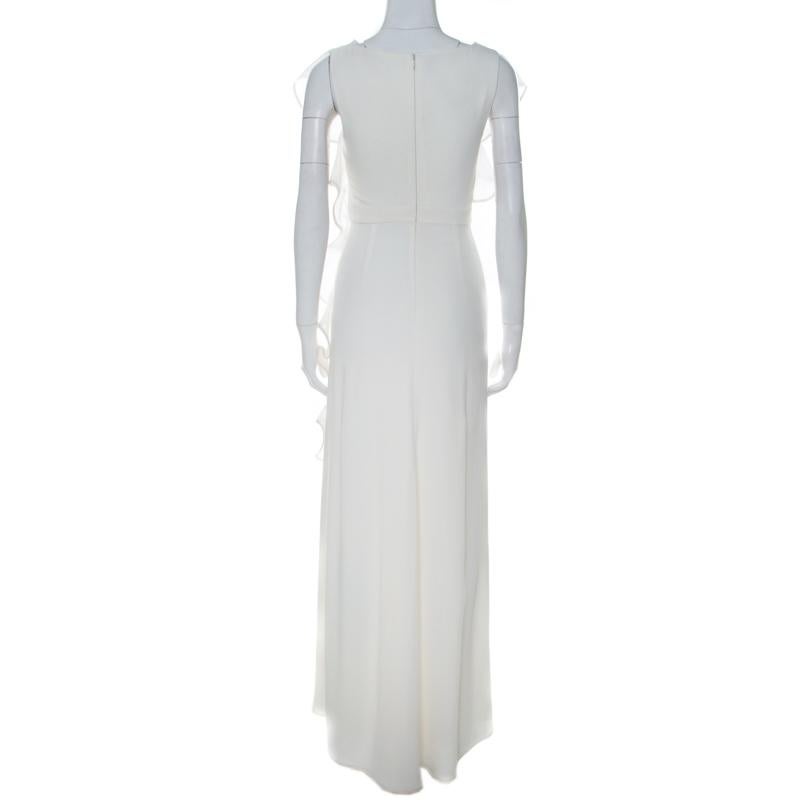 Inspired by elegant and romantic aesthetics, the Valentino gown has been given a refreshing off-white hue and the admirable ruffle trims to give the outfit a feminine finish. The sleeveless silhouette, complementing belt featuring a notable bow and