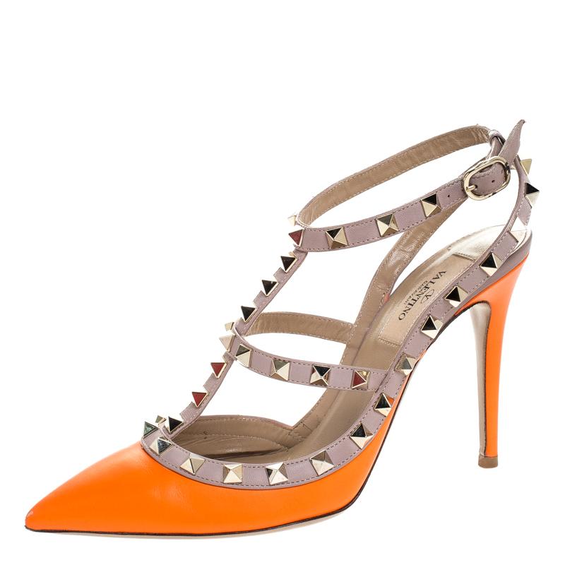 Instantly recognisable, the Rockstud sandals from Valentino are one of the most iconic styles from the brand. These orange sandals have been crafted from leather and styled with the signature Rockstuds on the beige straps. They are complete with