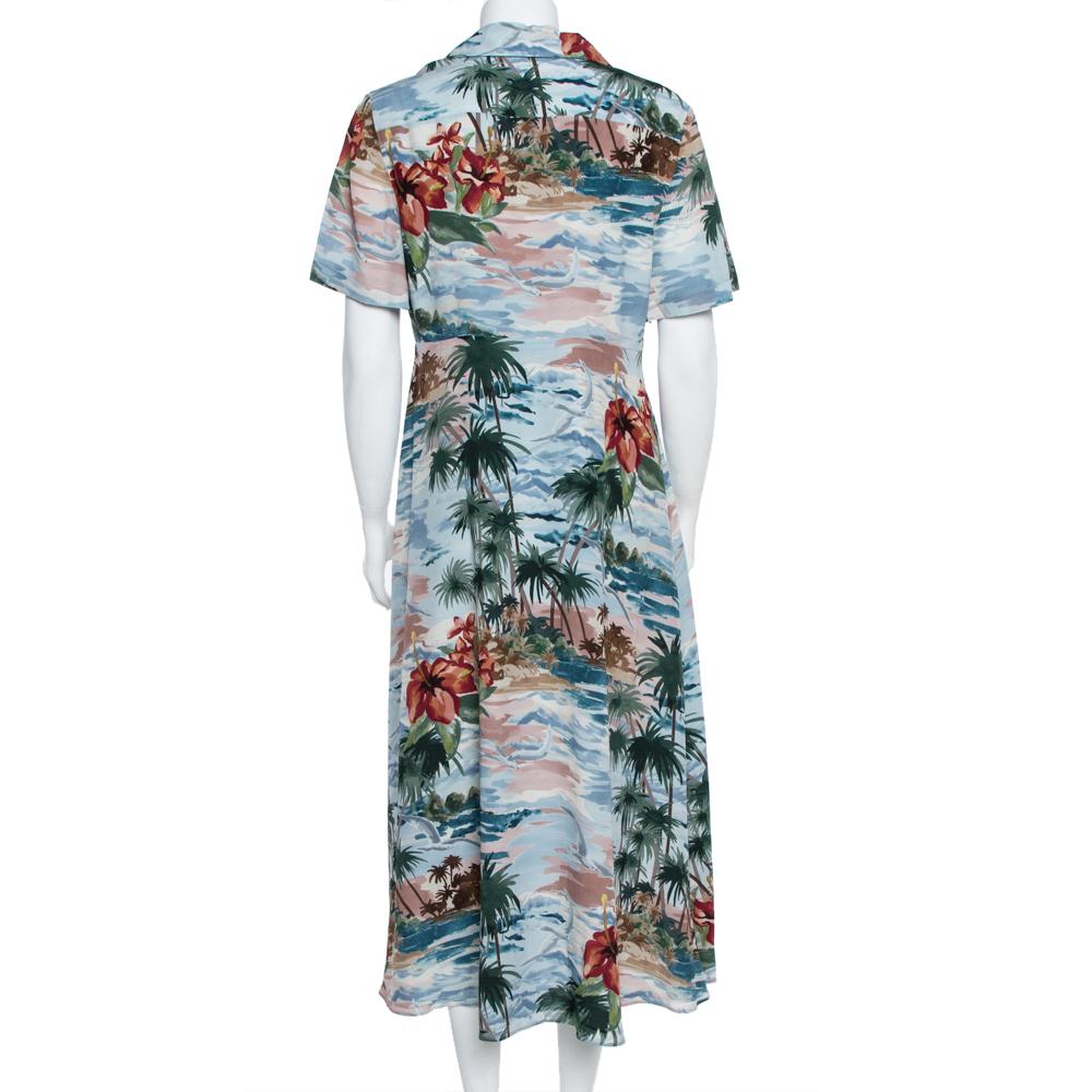 A phenomenal Hawaiian print is gloriously displayed on this shirt dress from the house of Valentino. Designed in a relaxed silhouette, the outfit has a feminine vibe and falls below the knee. The dress, amazing in a pale blue hue, will be a winner