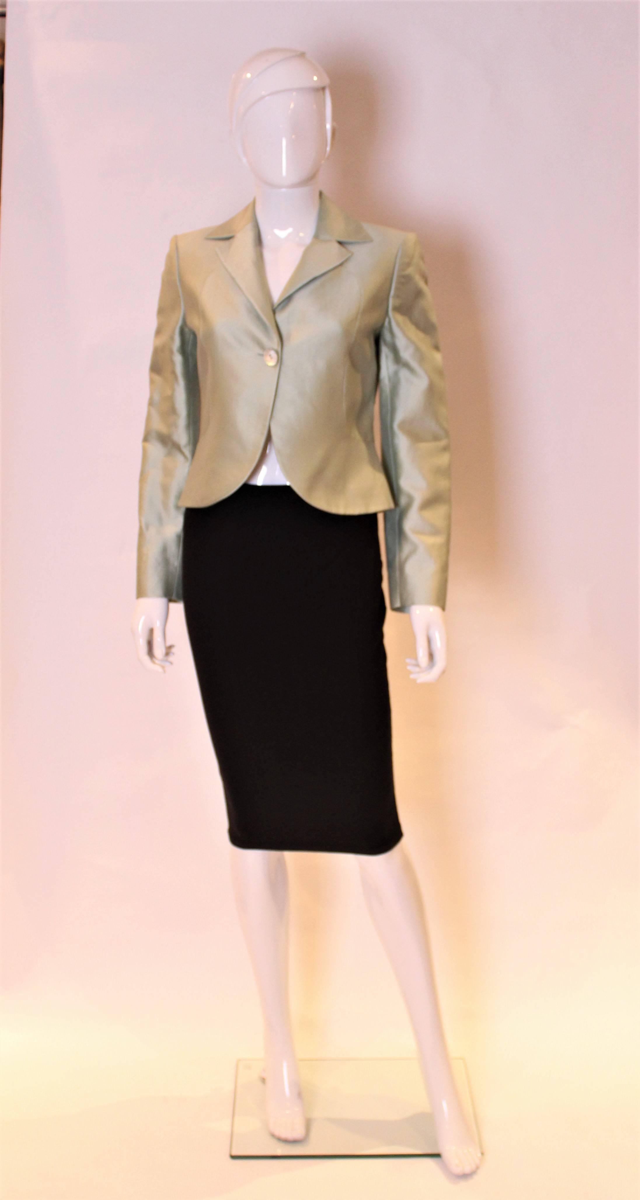 A chic jacket for Spring by Valentino, Roma. The jacket is in a pale green and the fabric is a silk and cotton mix with wonderful seam detail.
