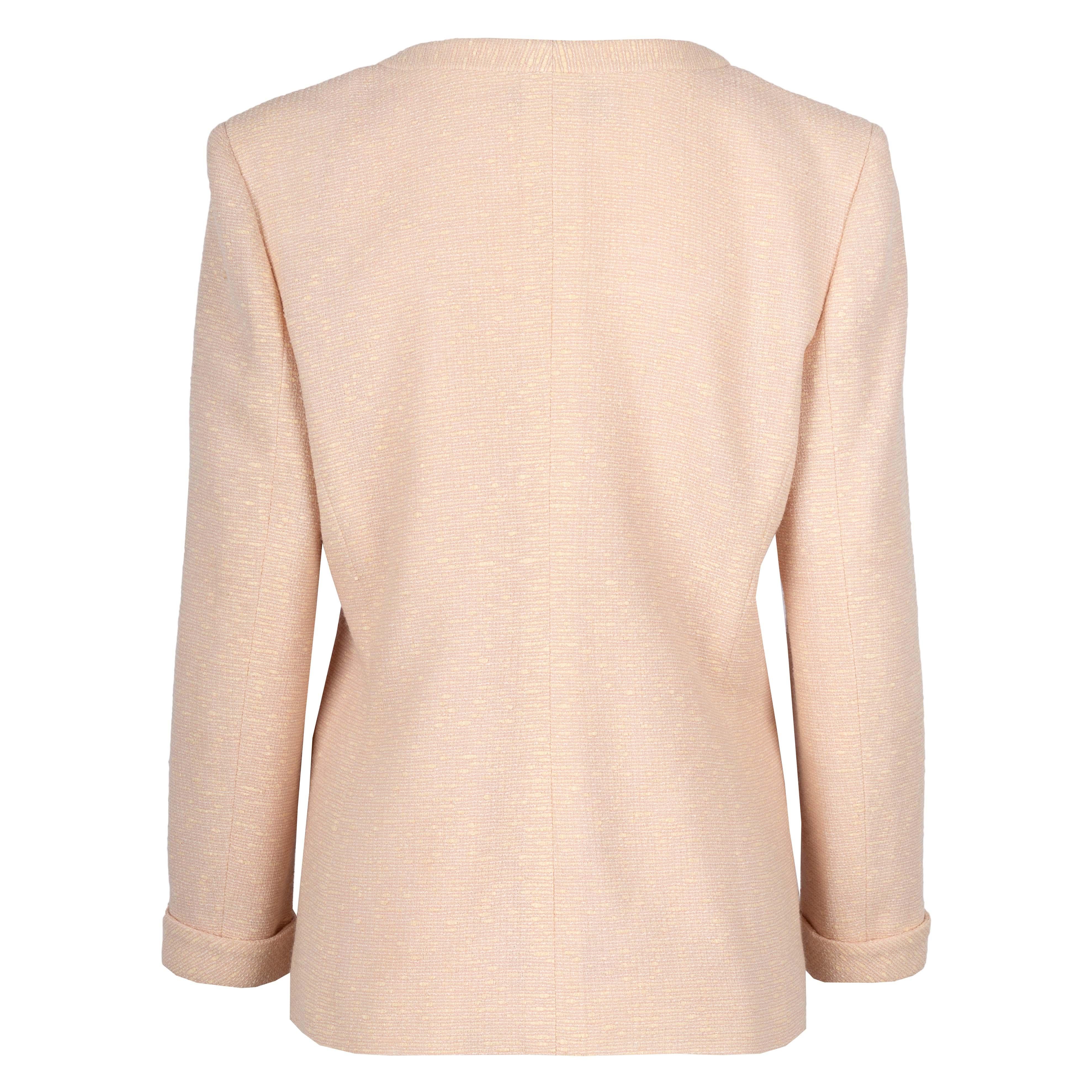 The Valentino pale pink jacket is a wool-cotton blend that features a round-neck collar and turn-up sleeves. The three pockets on the front help in safely securing small essentials. Please note that the buttons of this jacket need to be mended.