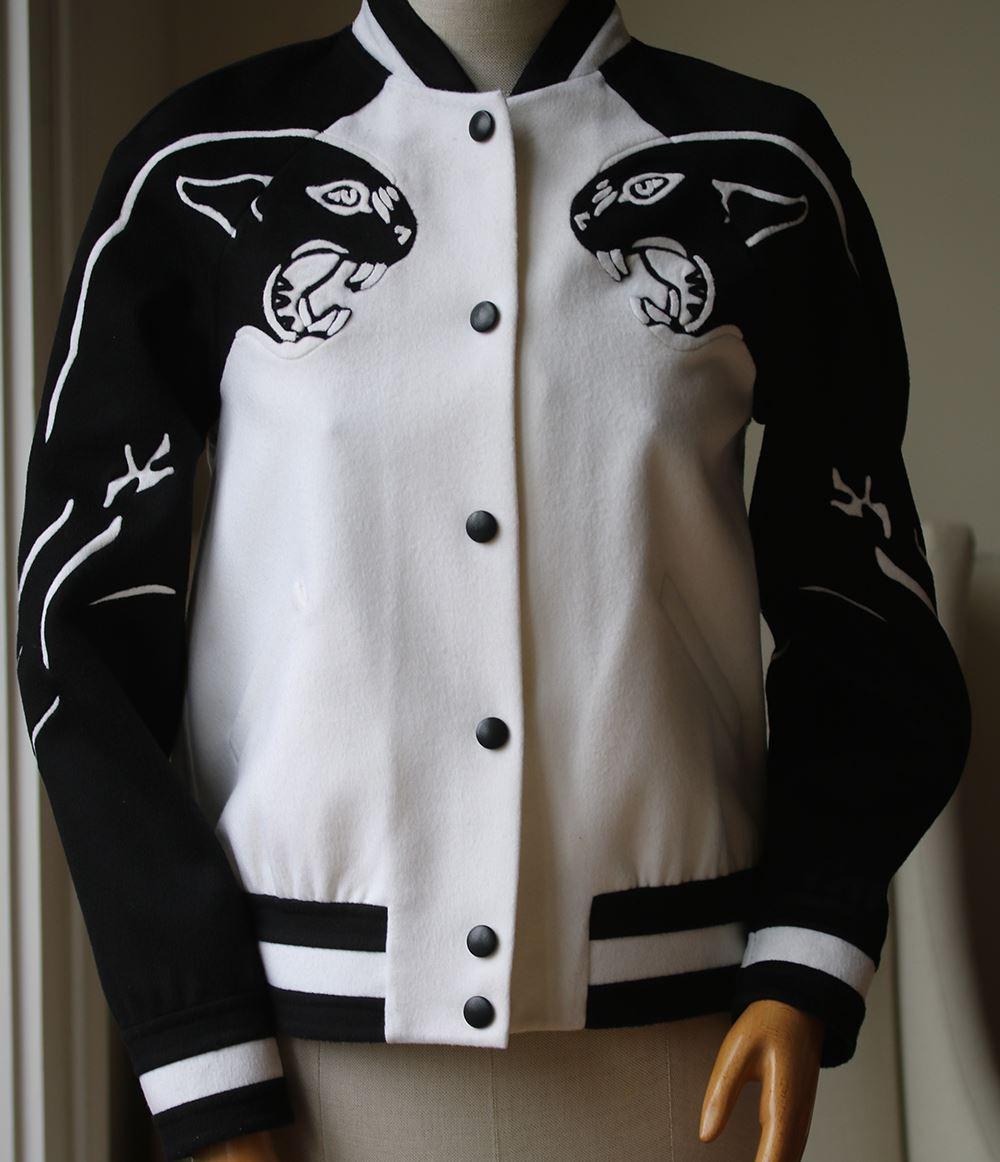 Valentino offers an ultra-trendy piece in black and white with this Panther Wool Varsity Jacket. Its slightly oversized yet structured blouson cut is adorned with a contrasting panther print. 95% Wool, 5% Cashmere.

Size - US 4 (UK 8, FR 36, IT
