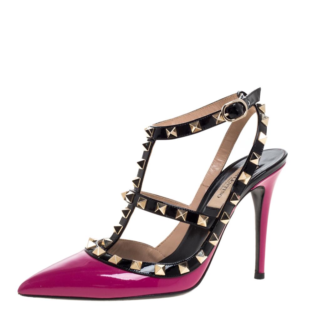 The iconic design from Valentino comes in pink and black with this pair. Crafted using patent leather, the sandals feature pointed toes, buckle fastening and 10 cm heels. The signature studs in gold-tone add the right finishing touch.

