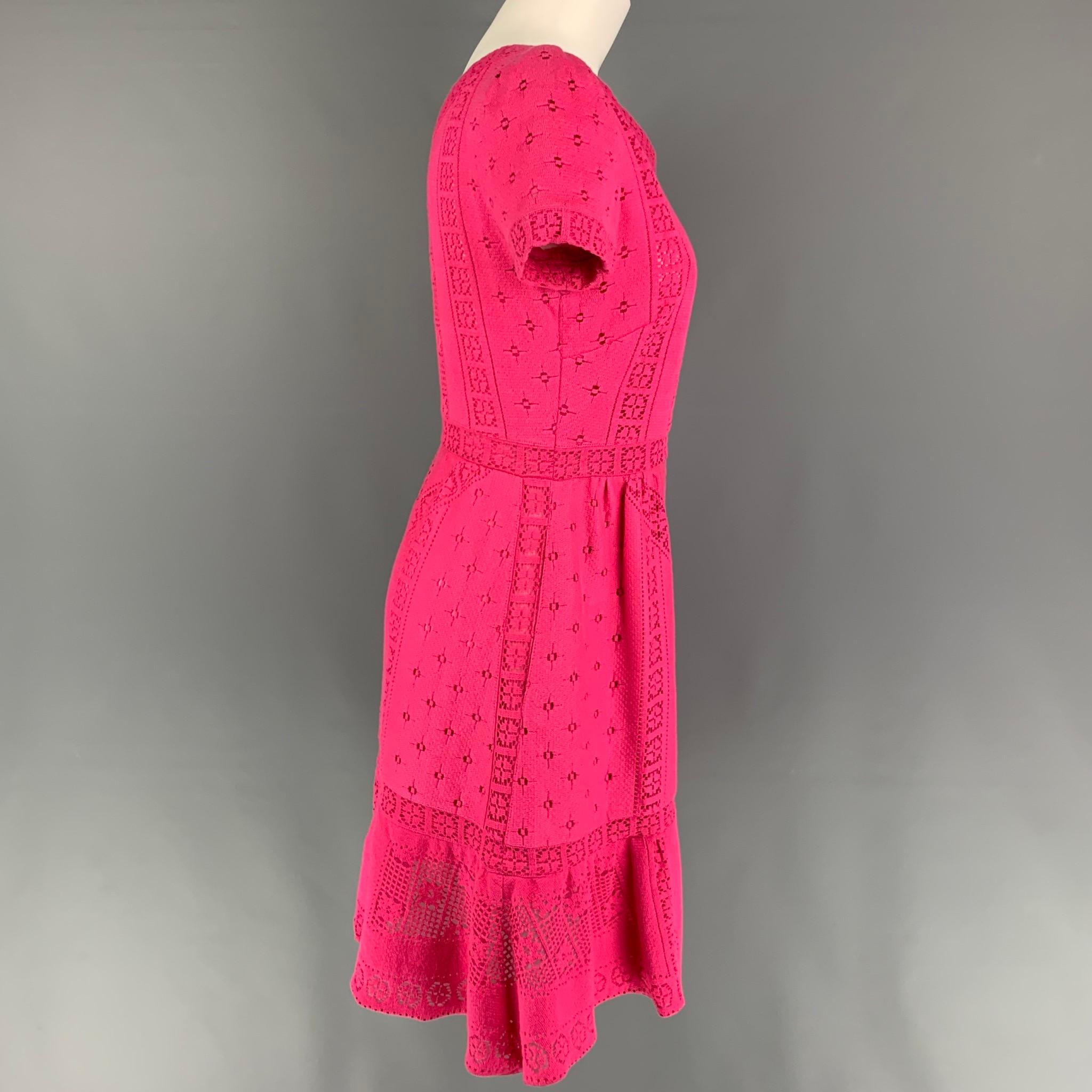 VALENTINO dress comes in a pink lace cotton / nylon with a slip liner featuring an a-line style, short sleeves, slit pockets, v-neck, and a side zipper closure. Made in Italy. 

Very Good Pre-Owned Condition. Fabric tag removed.
Marked: