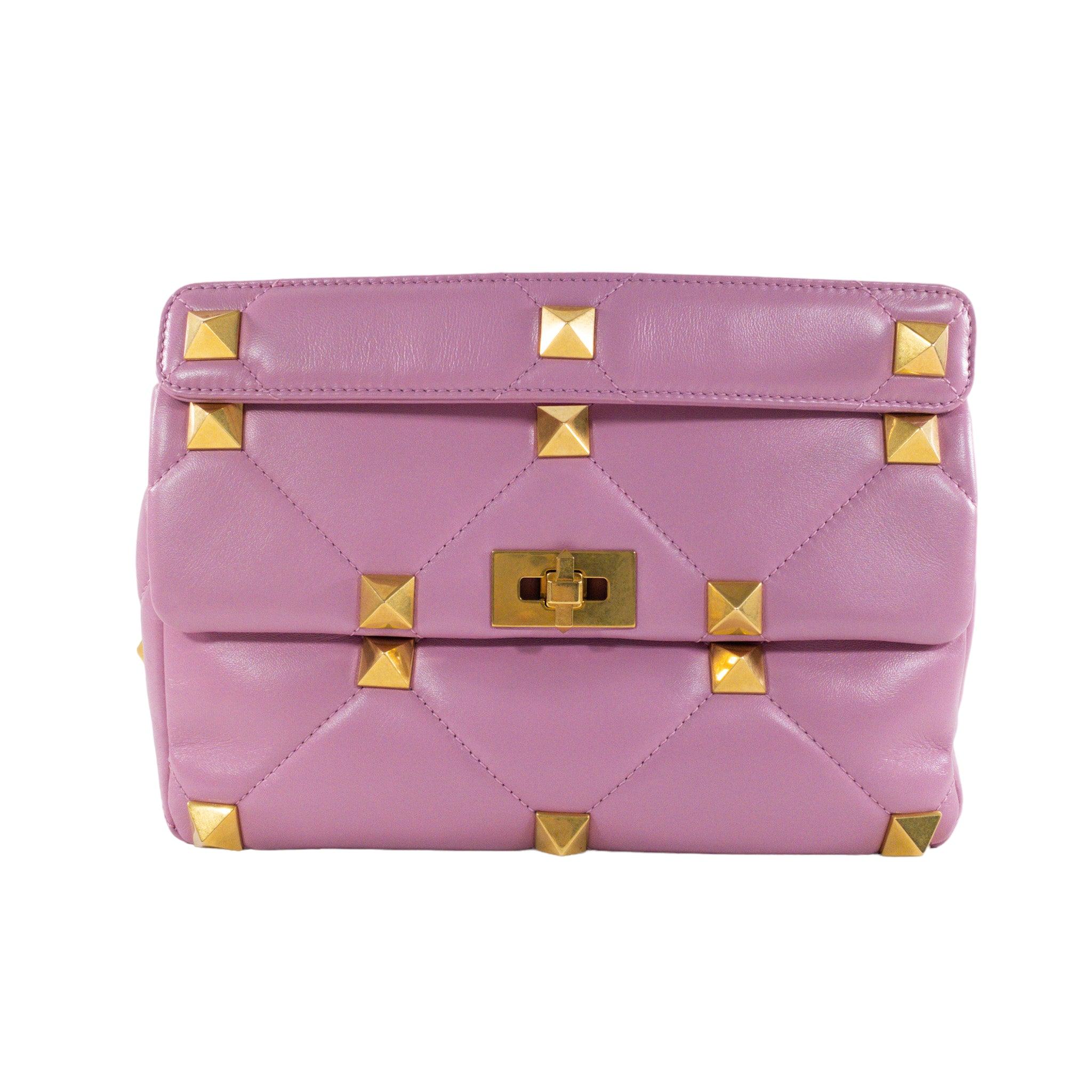 Valentino Pink Large Roman Stud Flap Bag

This is an authentic Valentino quilted Roman Stud Flap bag. Gold hardware Top handle with turn lock closure and detachable chain strap. Lined in leather, one interior zipped pocket. 

Additional