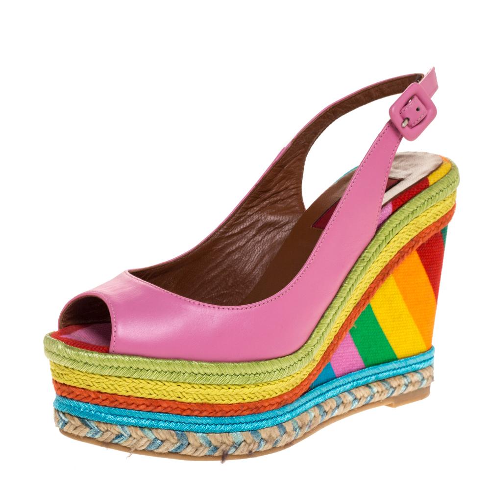 Combining the joy of comfort with great craftsmanship, these leather sandals by Valentino are meant to be yours. They bring a design of peep toes, buckle-held slingbacks and colorful espadrille wedge heels for a beautiful lift.

