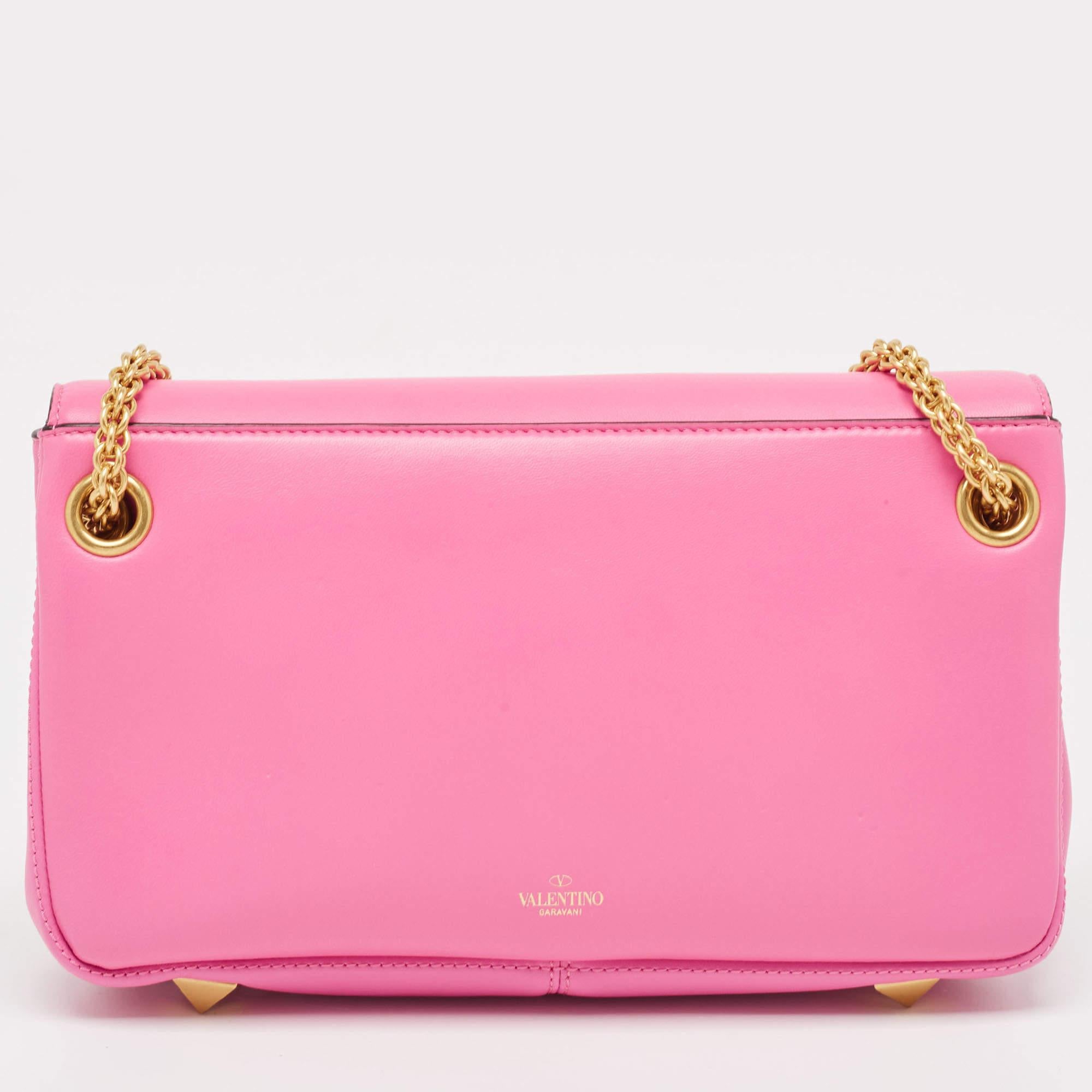 The Valentino handbag is a luxurious accessory crafted with precision. Made from high-quality materials, it features a timeless design with meticulous stitching, signature details, and durable hardware. Well-spaced and stylish, it exudes elegance