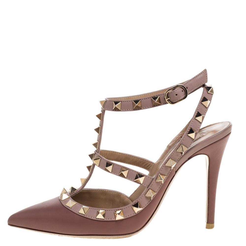 One of Valentino's most iconic designs, the Rockstud sandal is a timeless style. The shoe in pink leather has pointed toes, slim heels and the signature studs on the straps. You'll love wearing these!

