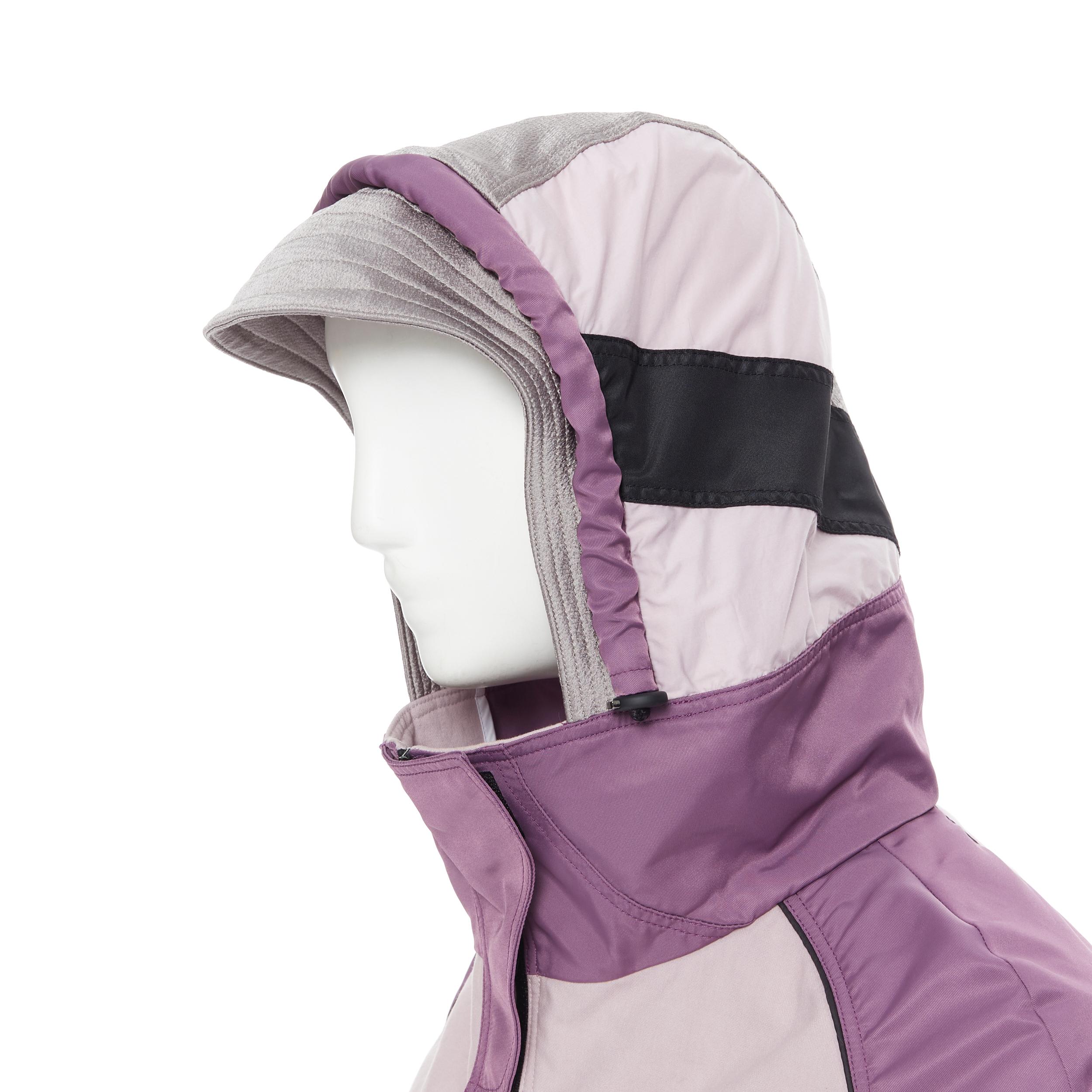 VALENTINO pink purple colorblocked capelet layered windbreaker coat IT36 XS 
Reference: TGAS/B00119 
Brand: Valentino 
Material: Nylon 
Color: Purple 
Pattern: Solid 
Closure: Zip 
Extra Detail: Colo blocked. Velvet trimming detail. Detachable