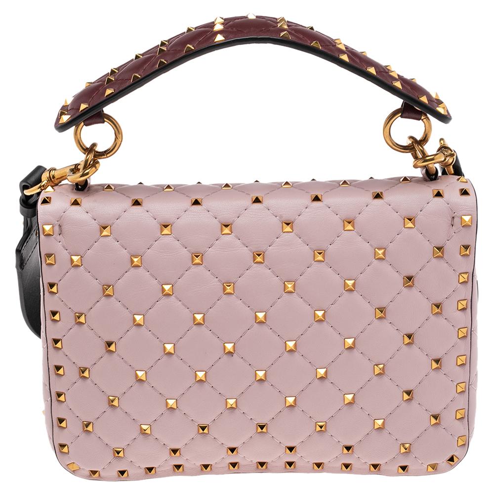 The Valentino Rockstud Spike bag is loved by celebrities and will help you create a statement-making look. It is secured by a twist lock on the flap and punctuated with the label’s signature Rockstuds, each artfully placed on the quilted leather
