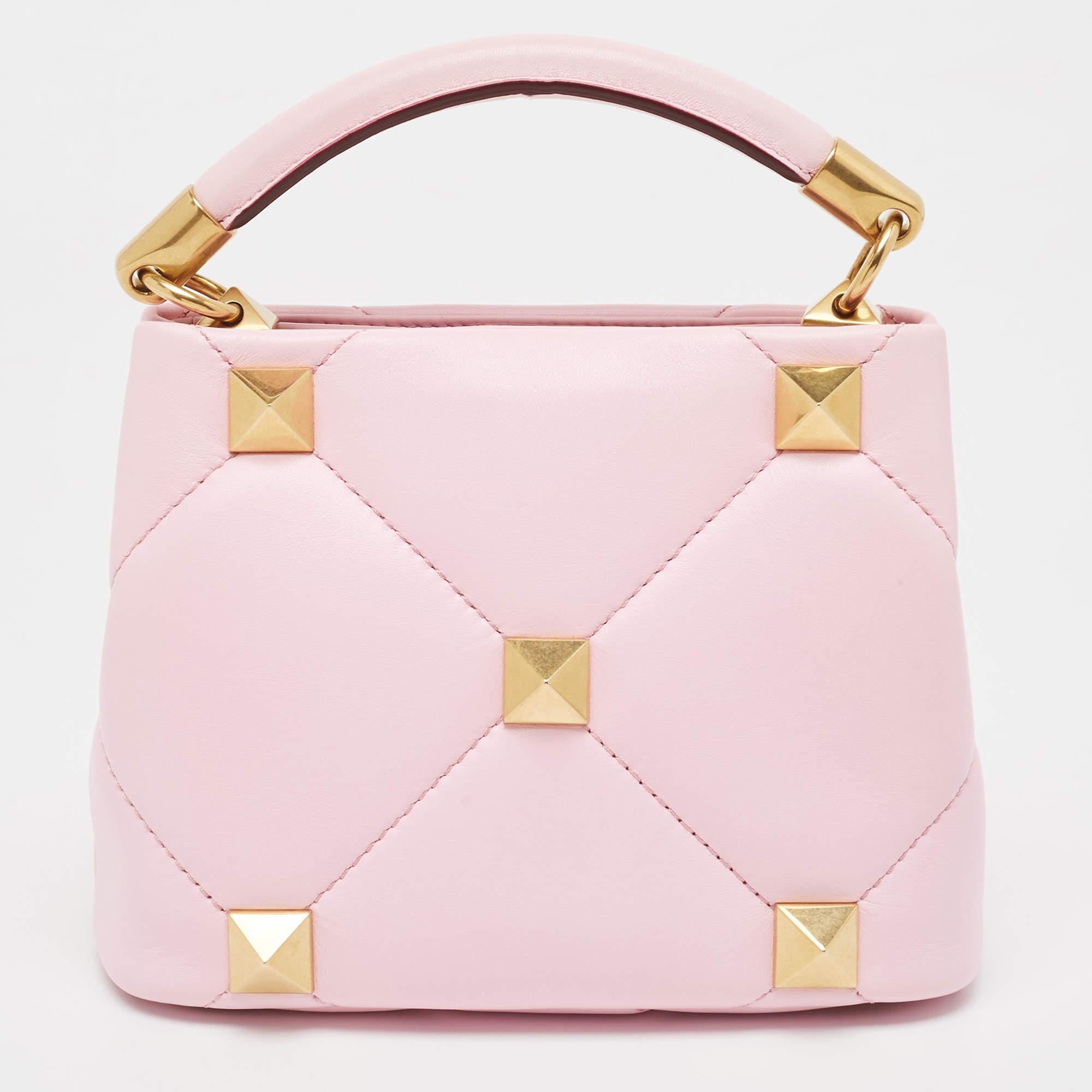 The Valentino handbag is a luxurious accessory crafted with precision. Made from high-quality materials, it features a timeless design with meticulous stitching, signature details, and shiny hardware. Well-spaced and stylish, it exudes elegance and