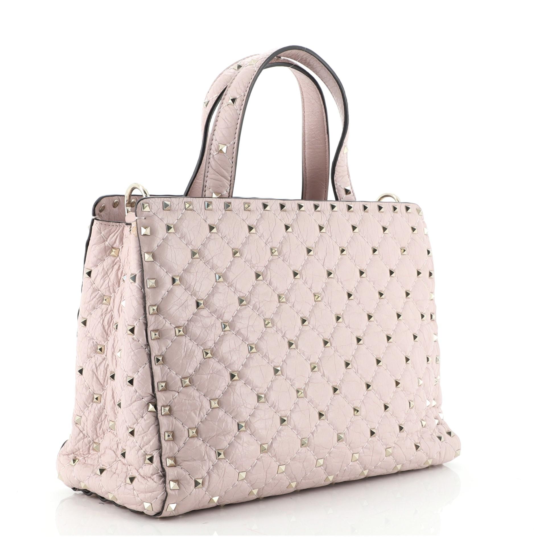 Valentino Pink Quilted Leather Rockstud Spike Top Handle Small Tote Bag

Condition Details: Odor in interior. Moderate creasing on rear near base, glue stains on side opening corners, wear and small marks in interior, scratches on hardware.

68290MSC