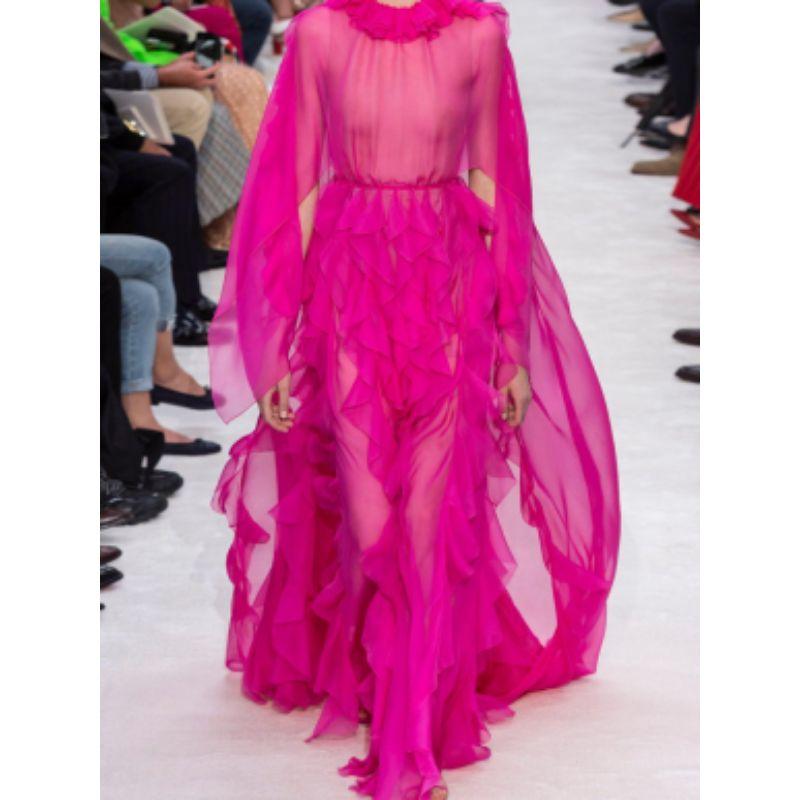 Valentino Pink Ruffle-collar Cape-sleeve Silk-chiffon Gown

- Ruffled throughout
- Slip dress 
- Zip fastening along back
- Draped shoulders
- Light construction
- Maxi length with small train

Material
100% Silk
Lining: 91% Viscose, 9%