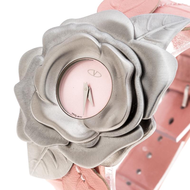 At first glance, one would think this piece is a bracelet, but it is actually a wristwatch. It is such a versatile creation. In a stainless steel case sculpted into a blooming flower, a pink dial sits right in the center, and it has two hands and