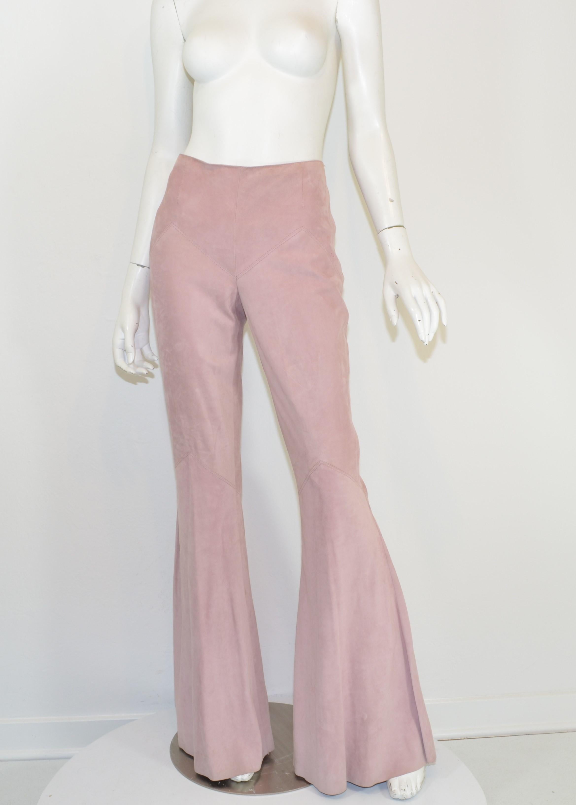 Valentino Pink Suede Flare Pants -- Featured in a blush pink suede with a side zipper and hook-and-eye fastening and a flared legs. Pants are in good condition showing some normal wears throughout and a few spots as pictured.

Measurements:
Waist