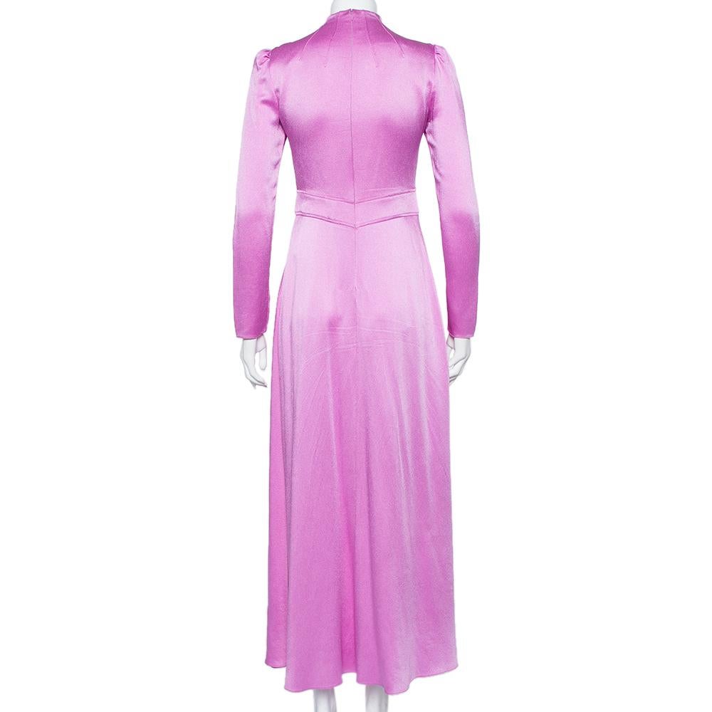 Valentino is known globally for its beautiful creations that are timeless! This maxi number is cut from the finest satin and designed with long sleeves. It features a high neckline and a flattering silhouette below the waist. It is equipped with a