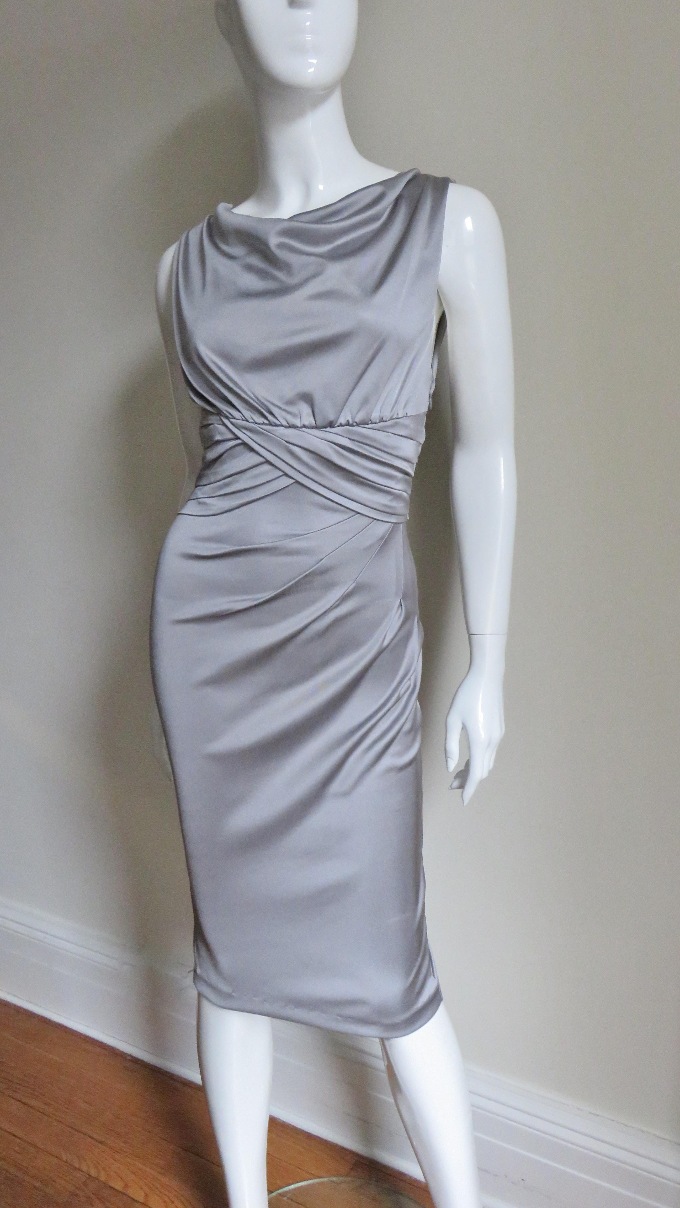 A beautiful grey fine silk jersey dress from Valentino.  It is sleeveless with a ruched waist and angled ruching across the front of the skirt creating very flattering lines. The bodice is lined in the same fabric and there is a matching side