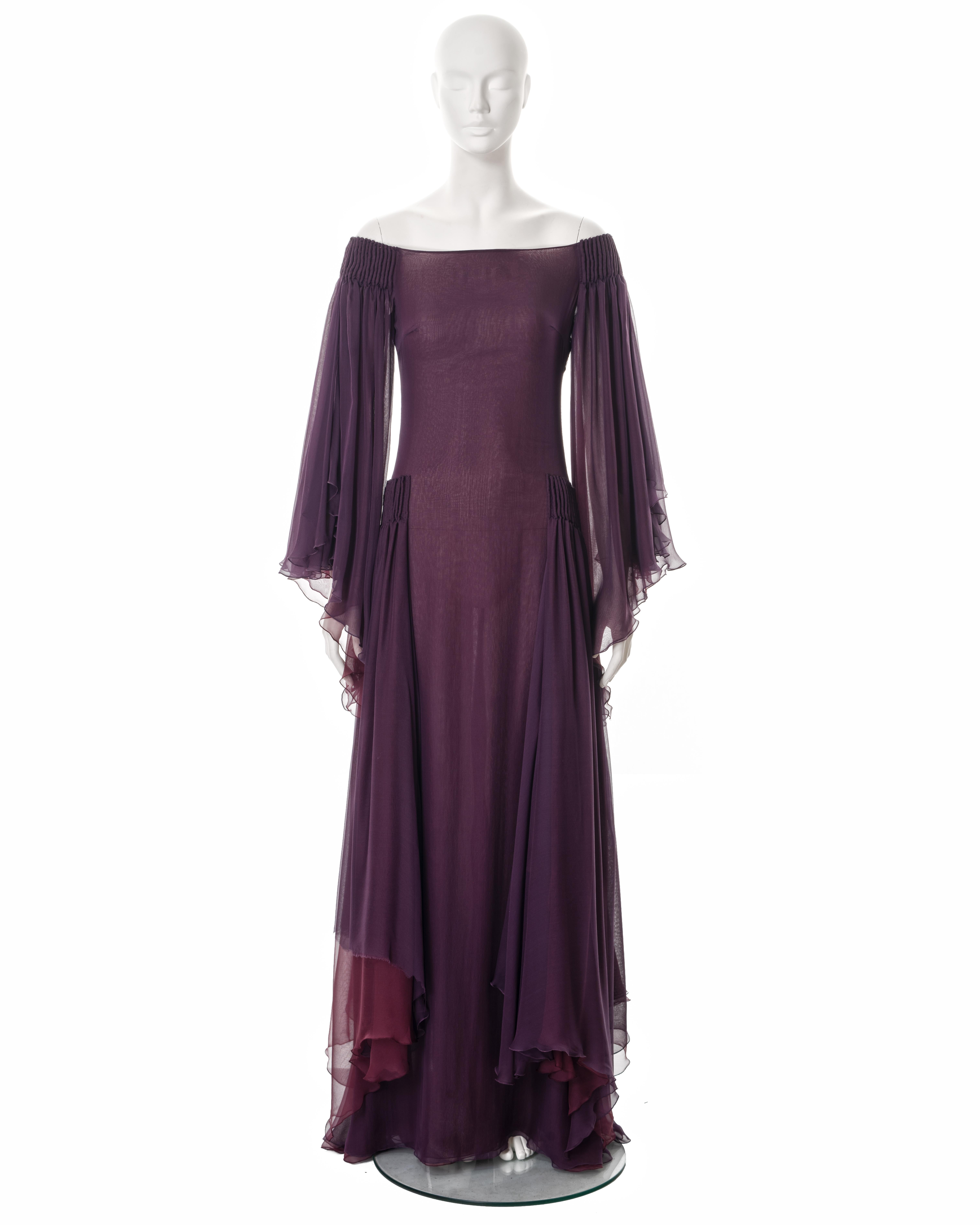 ▪ Valentino evening dress
▪ Sold by One of a Kind Archive
▪ Fall-Winter 2002
▪ Constructed from two layers of silk in plum and wine 
▪ Off-shoulder neckline 
▪ Inverted pleats at the shoulder and hips
▪ Angel sleeves 
▪ Floor length skirt 
▪ Size US