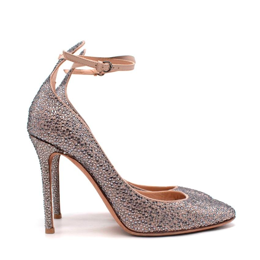 Valentino Poudre Leather Crystal Embellished Ankle Strap Pumps
 

 - Nude leather upper embellished in dark silver crystals
 - Tonal, adjustable ankle strap with a silver-tone buckle
 - Round toe, set on a stiletto heel
 

 Materials:
 Leather
 

