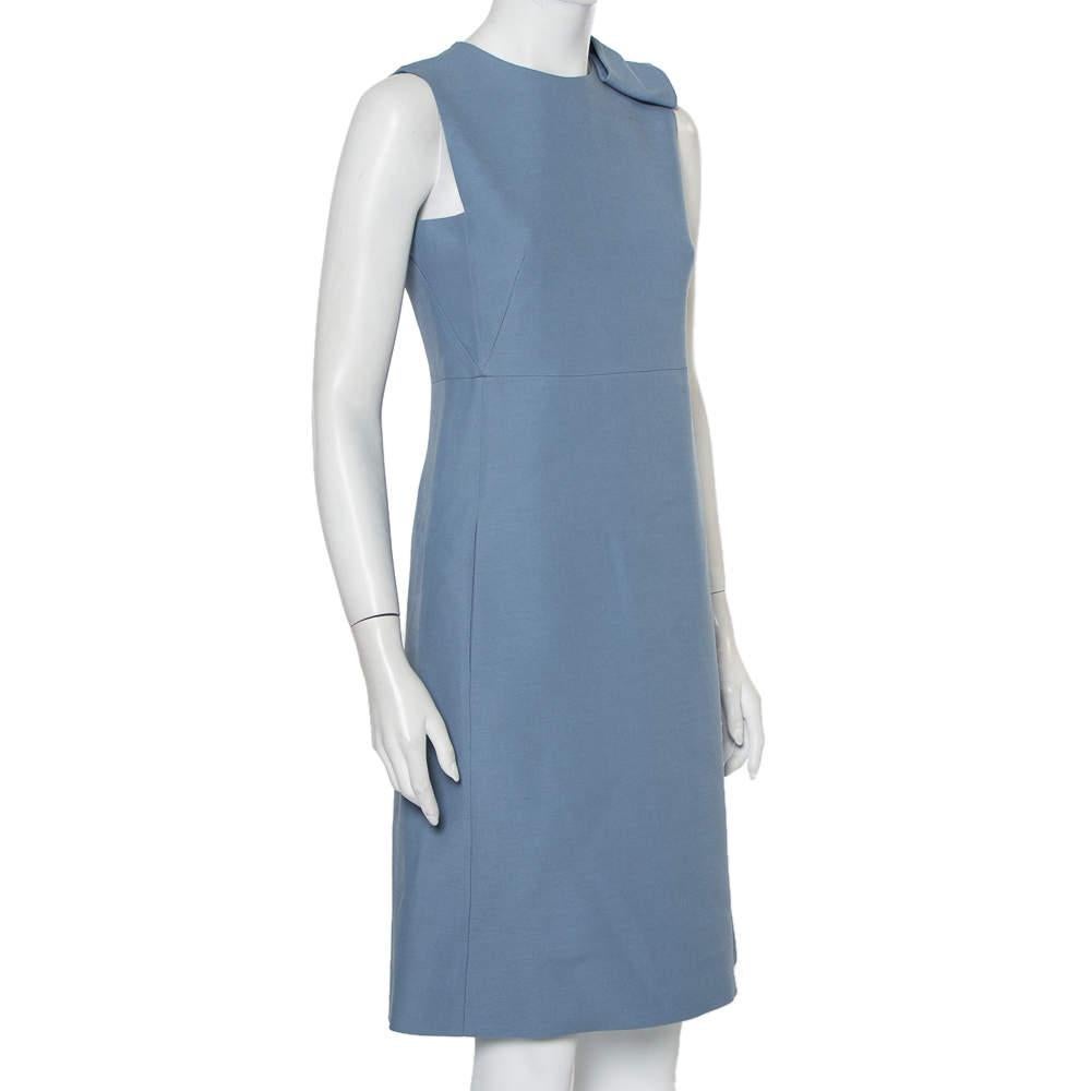 This dress is a flawless example of Valentino's ingenious design put together with up-to-date fashion trends. Match your accessories with this elegant blue attire and look your stylish best. This dress is masterfully fashioned from wool and silk to