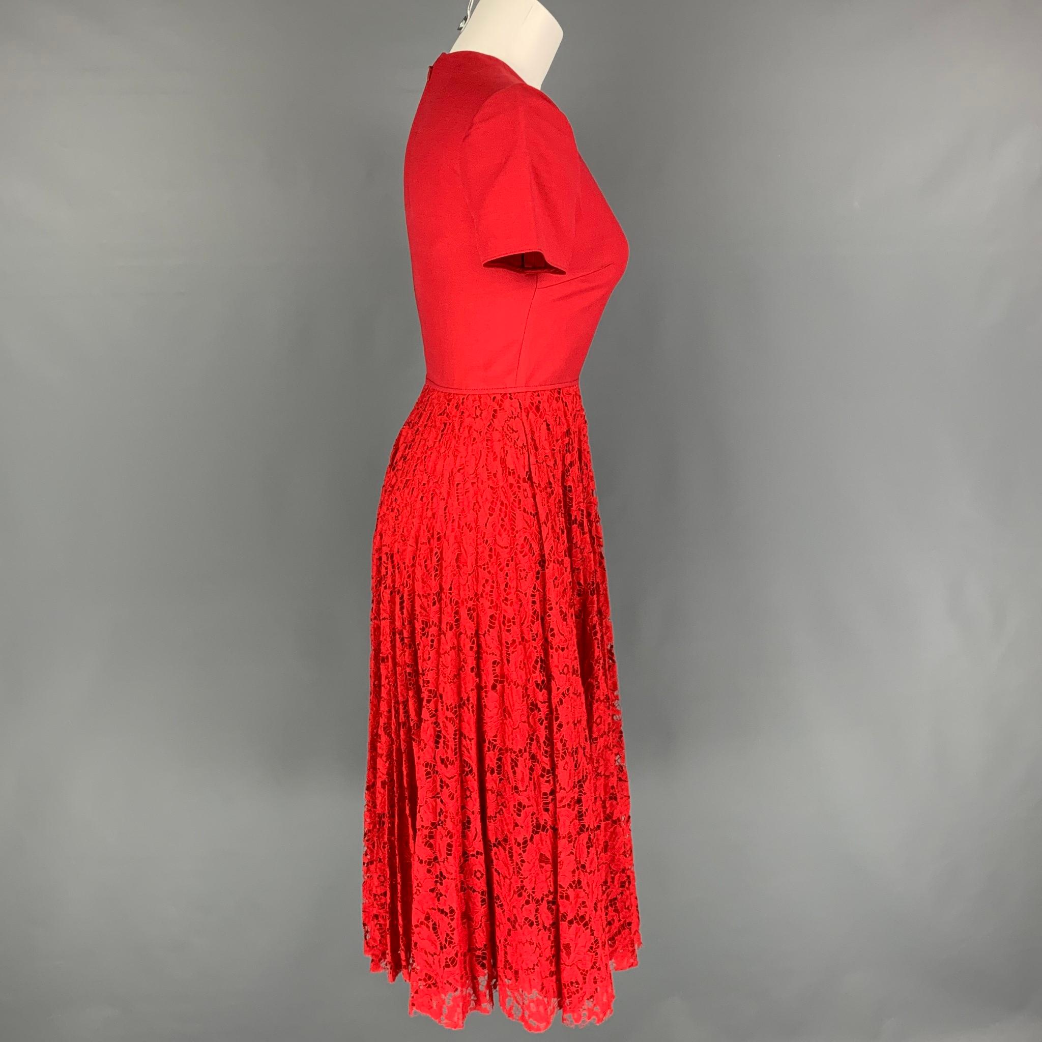 VALENTINO Pre-Fall 19 dress comes in a red lace viscose blend featuring a fitted bodice, pleated lace skirt, concealed hook & zip fastening at back. Made in Italy.

Very Good Pre-Owned Condition.
Marked: 36
Original Retail Price: