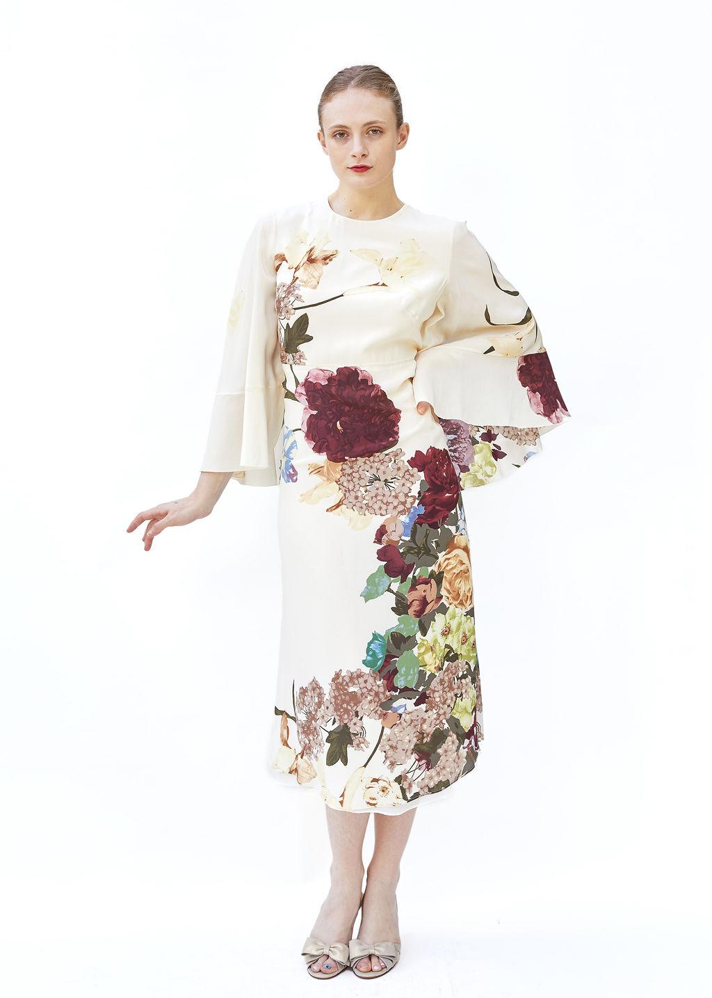 Introducing our Valentino Pre Fall 2016 Floral Dress with Cape - a beautiful remake of the iconic 1997 kimono print dress. Made with luxurious beige silk fabric and a vibrant dark floral print, this dress is perfect for a sophisticated wedding week