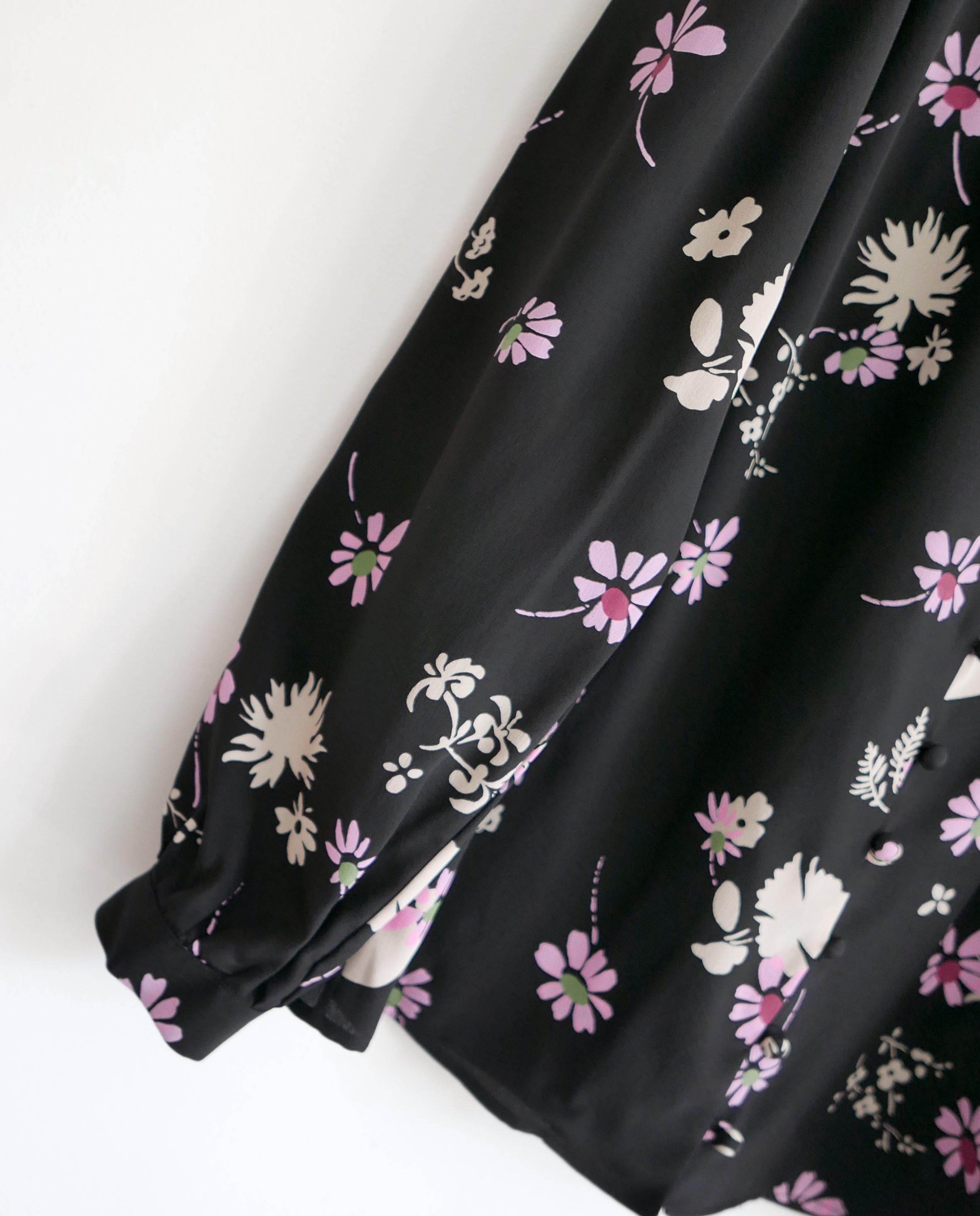 Stunning Valentino floral silk blouse from the Pre-Fall 2017 collection - look 14 on the runway. Bought for £1650 and new with tag. Made from smooth black crepe de chine with a pastel pink and green floral print. It has a 1970s inspired cut with