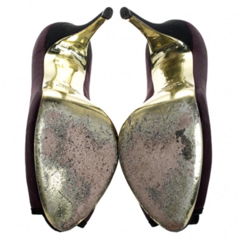 You can never go wrong with these sophisticated pumps by Valentino. These effortless pumps have been crafted from luxurious satin and come in stunning hues of purple and black. Designed to deliver style and class, they feature peep toes, platforms,