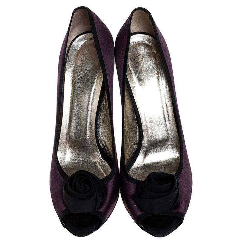 You can never go wrong with these sophisticated pumps by Valentino. These effortless pumps have been crafted from luxurious satin and come in stunning hues of purple and black. Designed to deliver style and class, they feature peep toes, platforms,