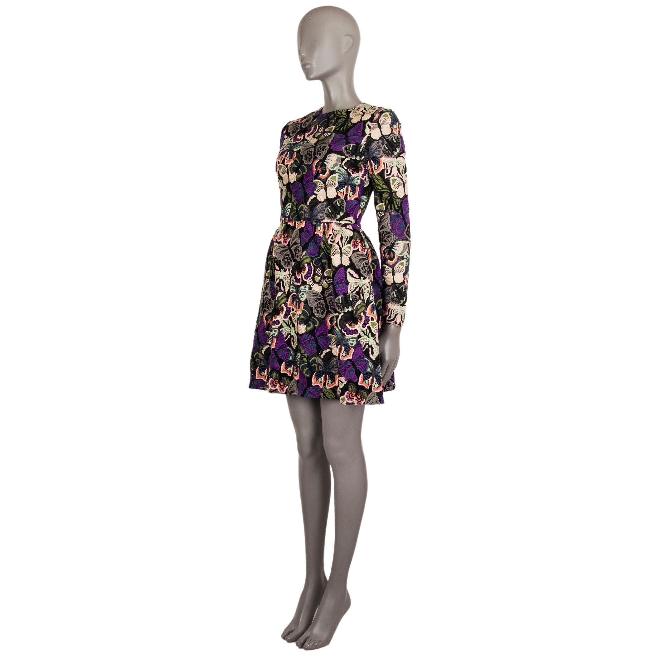 Valentino PF'14 butterfly-embroidered long-sleeve shift dress in black, purple, blue, green, grey,, mint, salmon, chartreuse, rose, and nude cotton (100%), nylon (100%), and silk (100%). With gathered skirt and two slit pockets on the sides. Lined