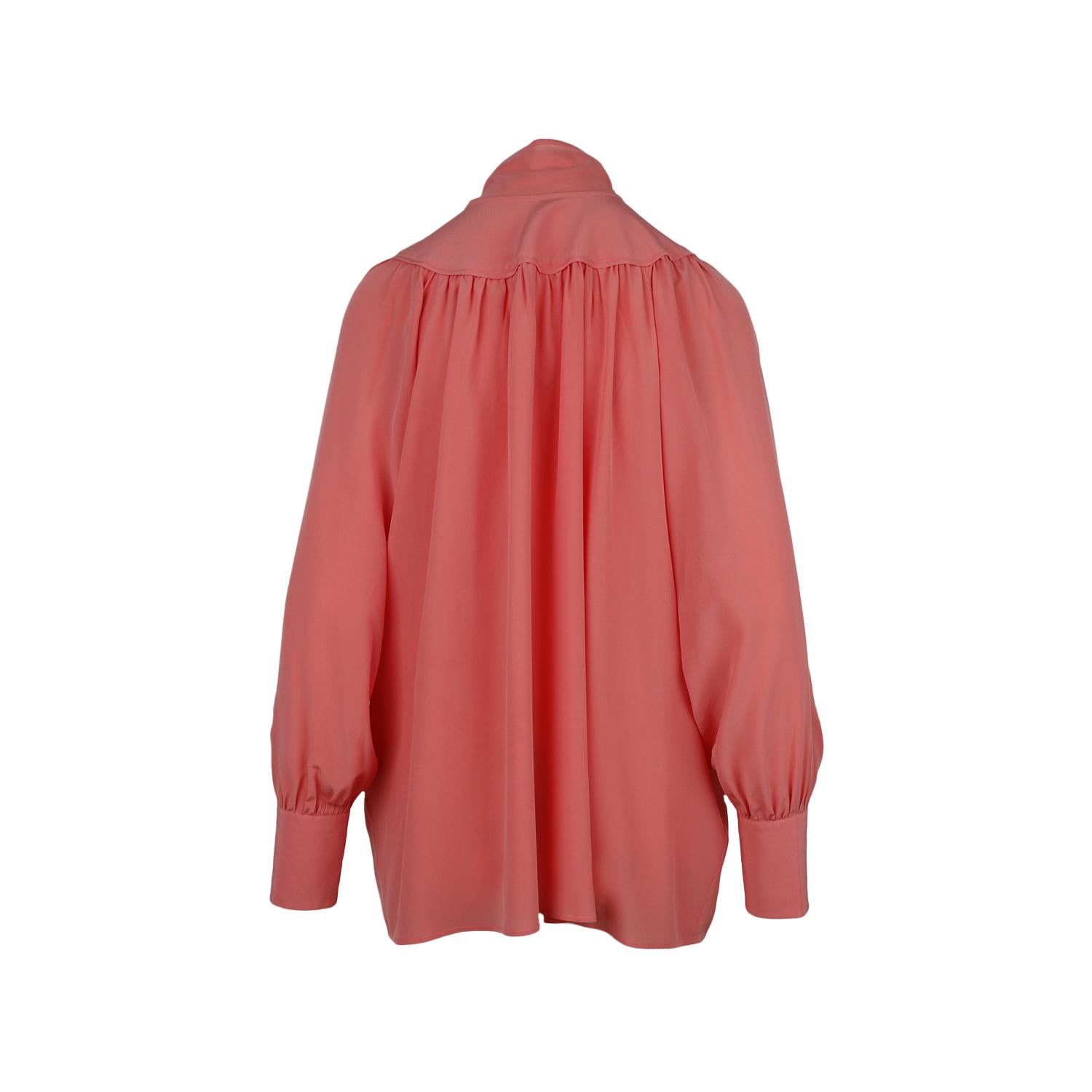 Valentino silk pink blouse featuring pussy-bow, long sleeve and button fastening.